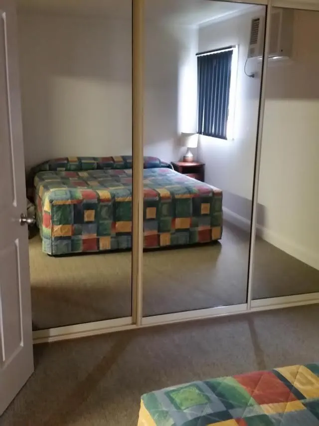 Bed in Augathella Palms Motel