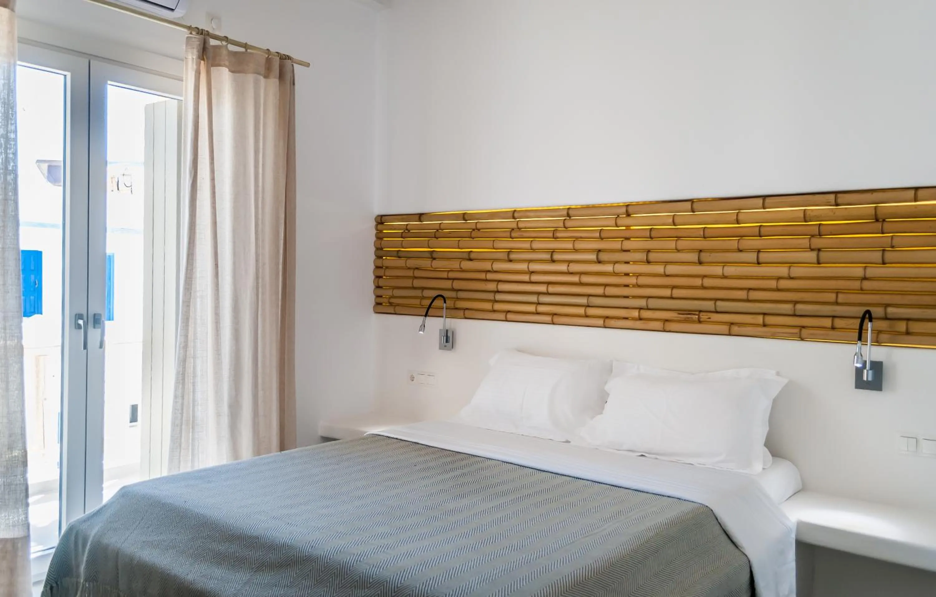 Bed in Vilos Suites