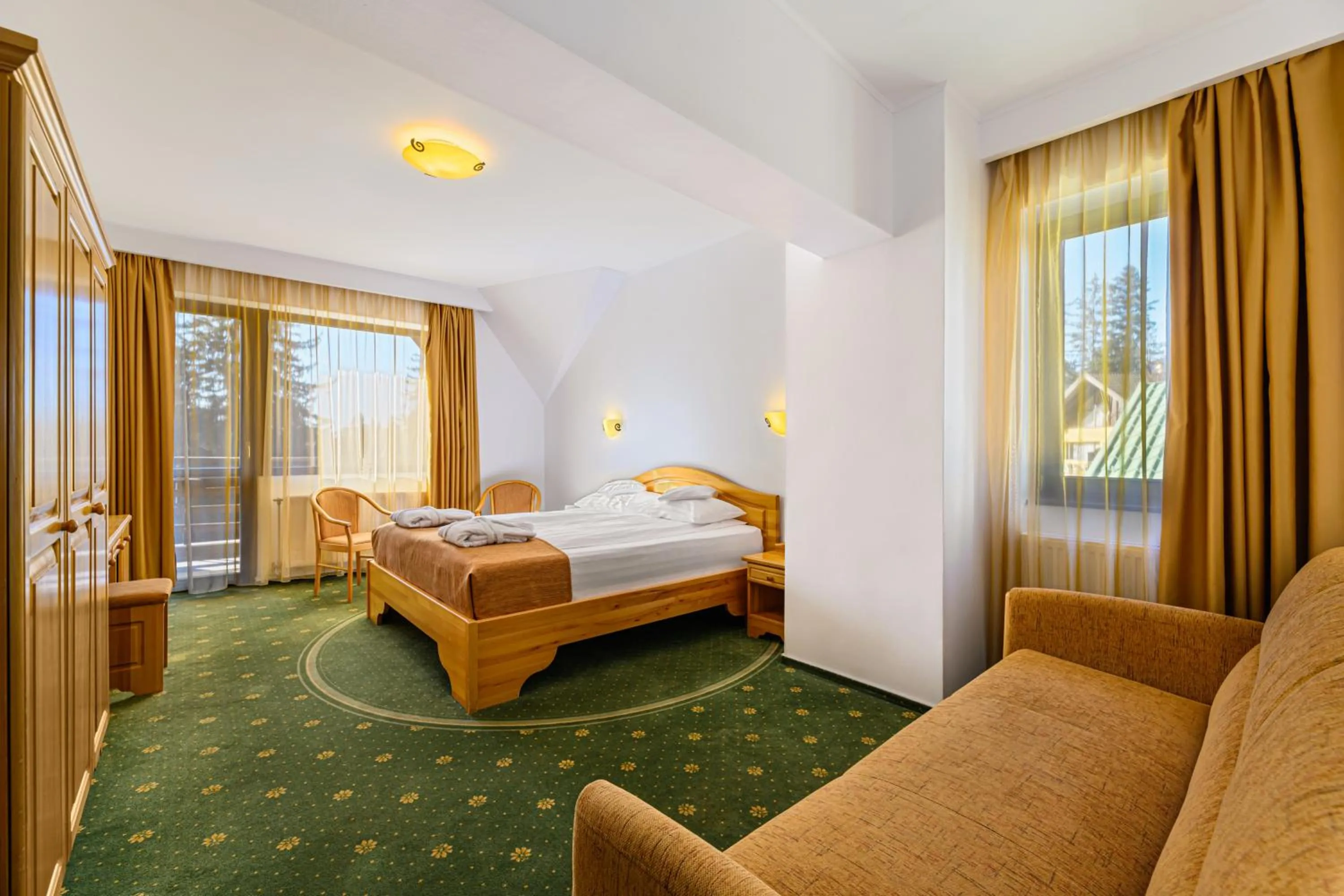 Bed in Hotel Casa Viorel jacuzzi & saunas