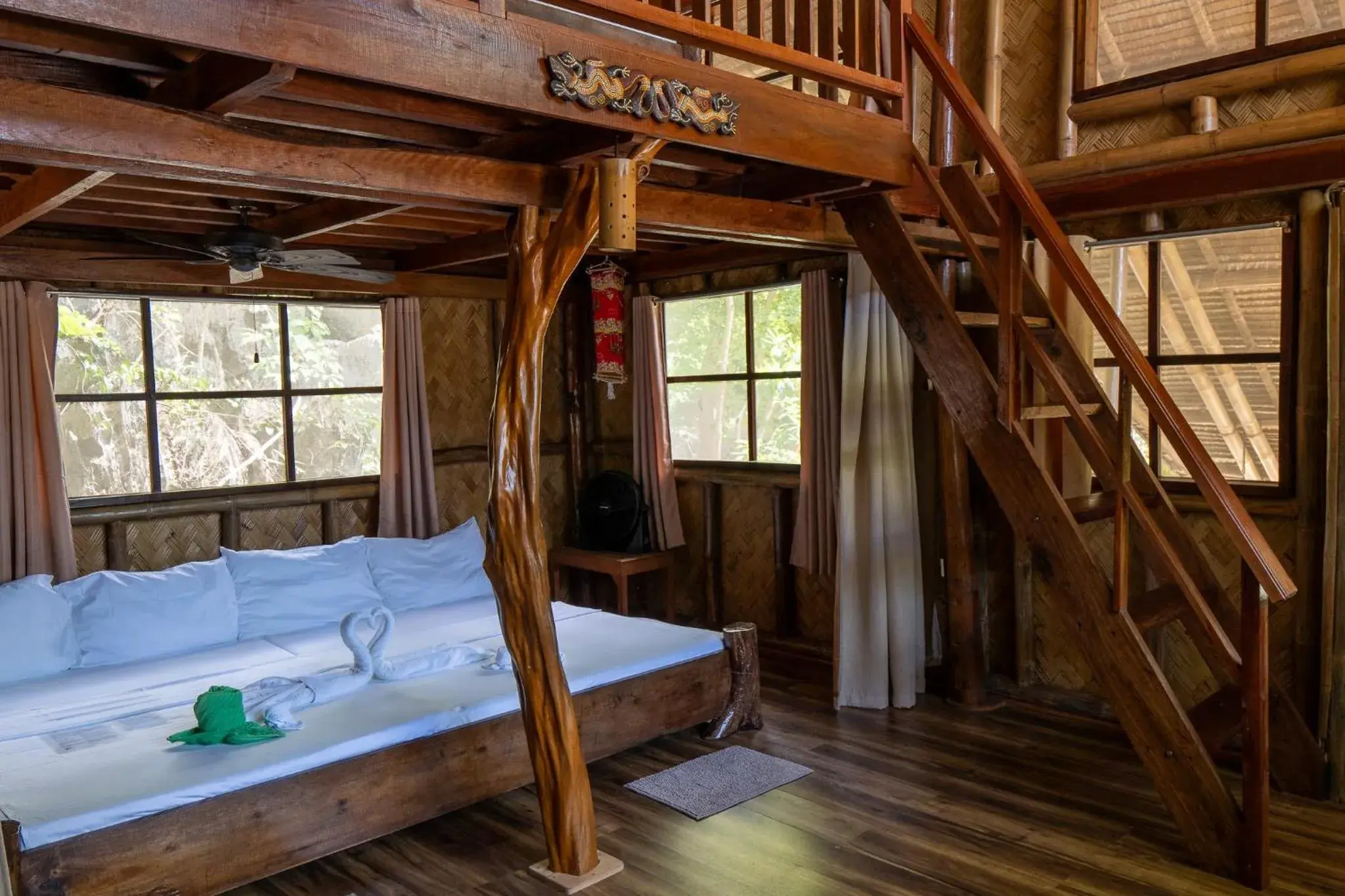 Bed in Sangat Island Dive Resort Bed in Sangat Island Dive Resort