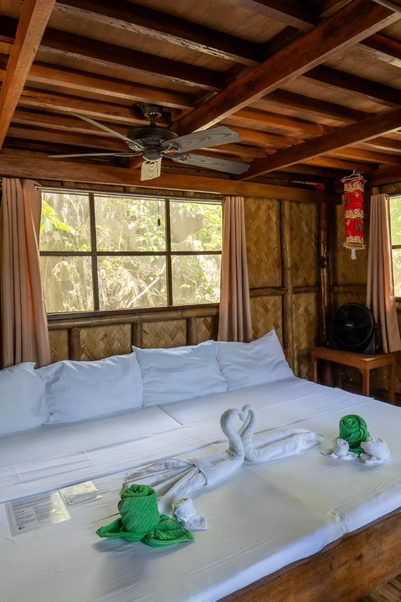 Bed in Sangat Island Dive Resort Bed in Sangat Island Dive Resort