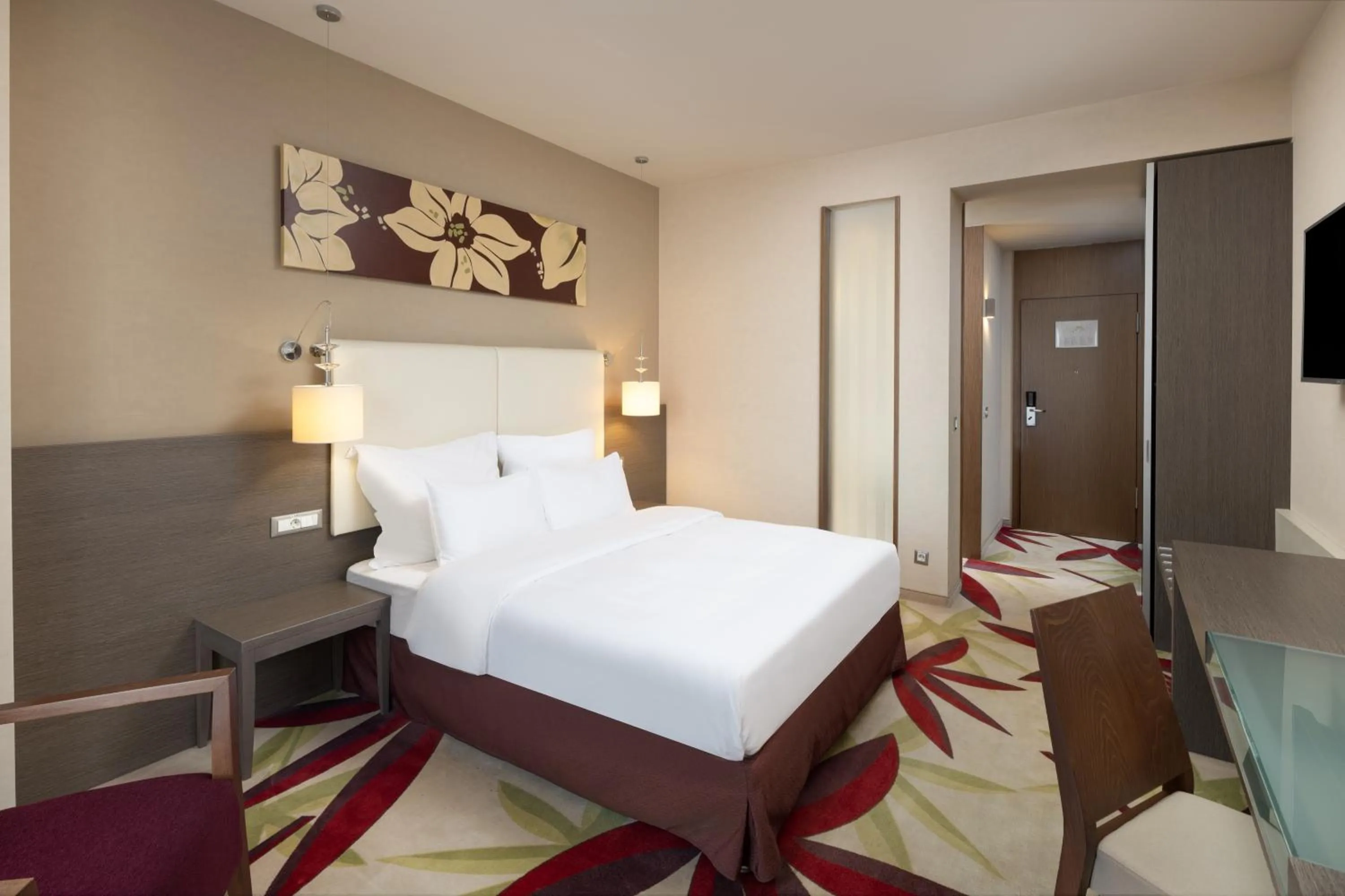 Bed in Golden Tulip Ana Dome Hotel