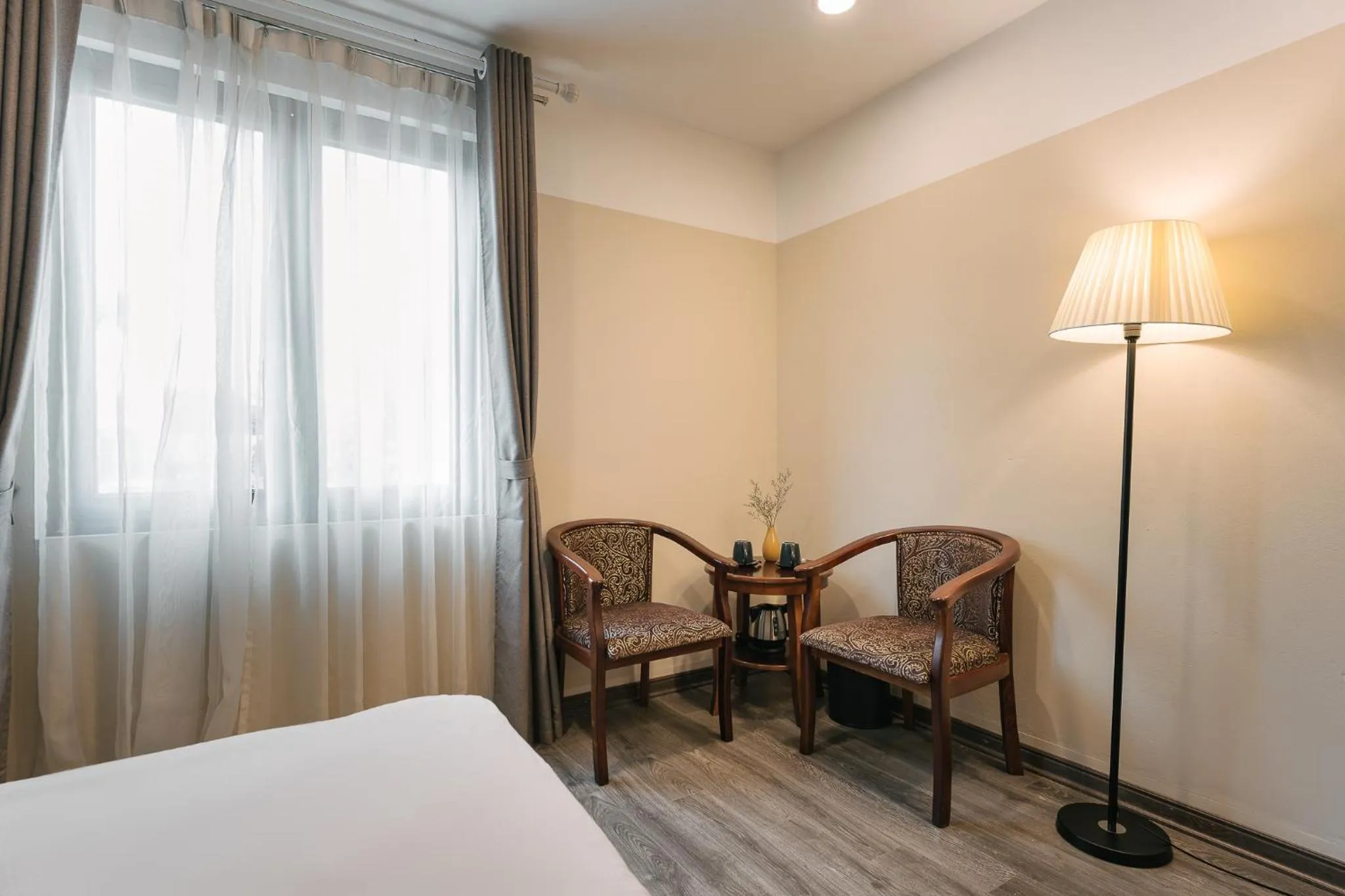 Seating area, Bed in An Nguyen Boutique Hotel
