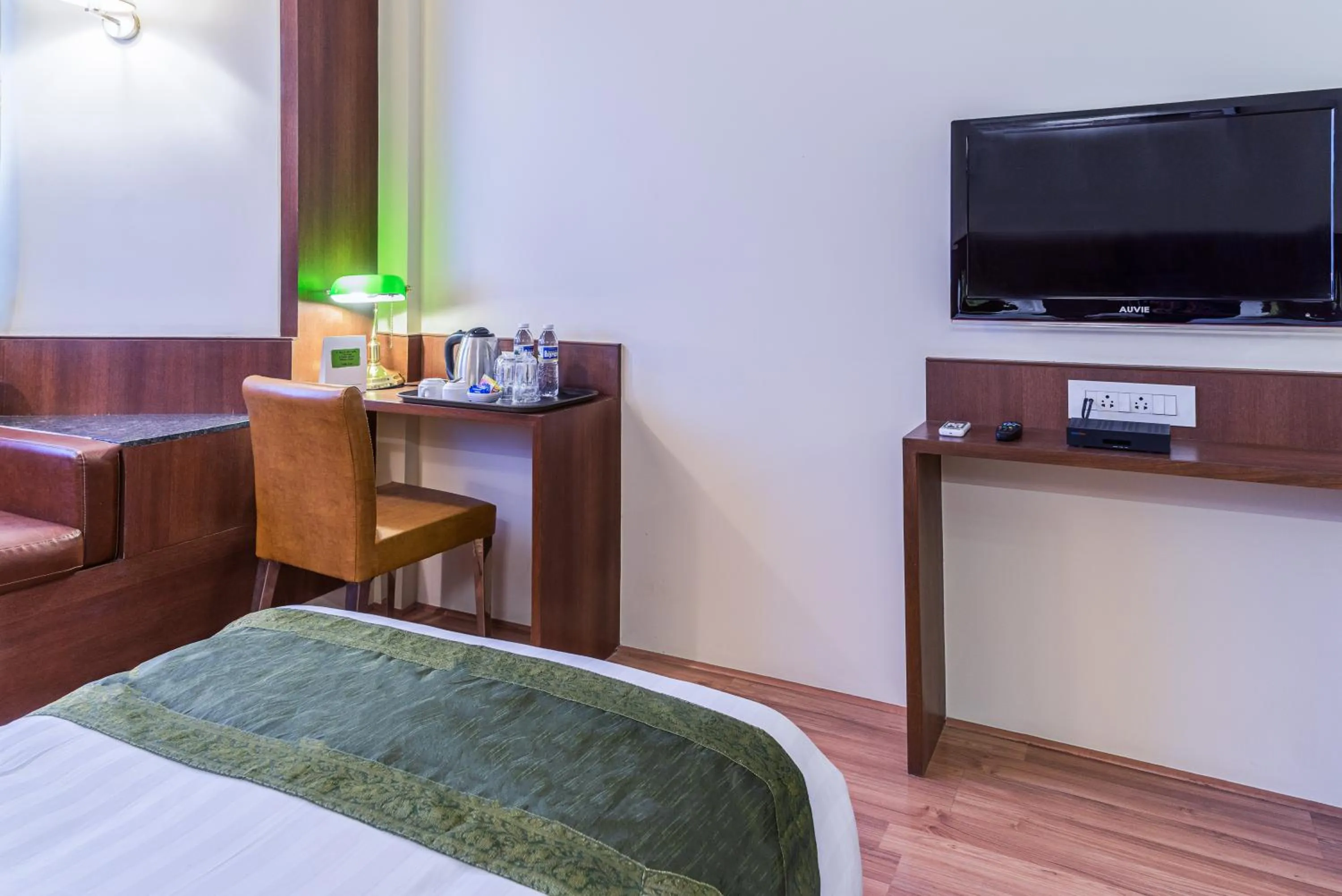 Bed in Treebo Premium Grand Emerald