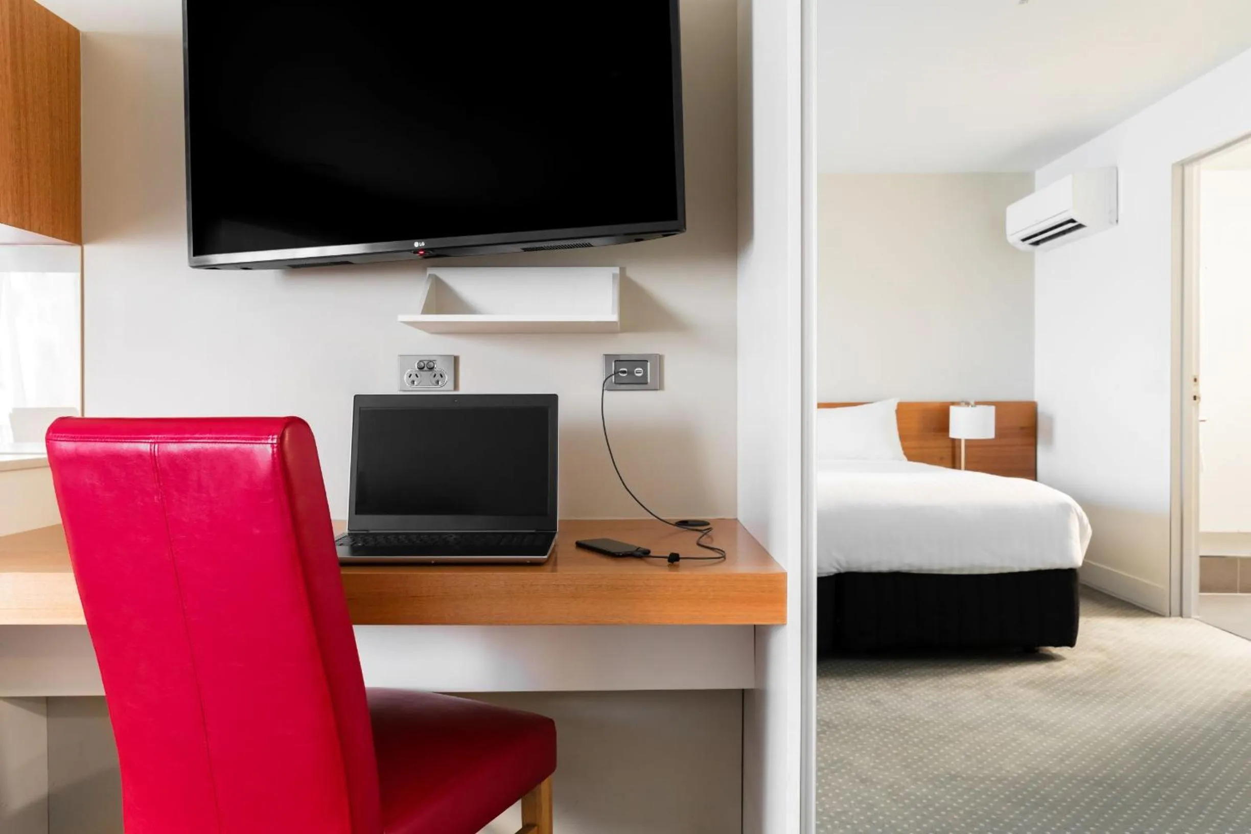 Seating area, Bed in The Old Woolstore Apartment Hotel