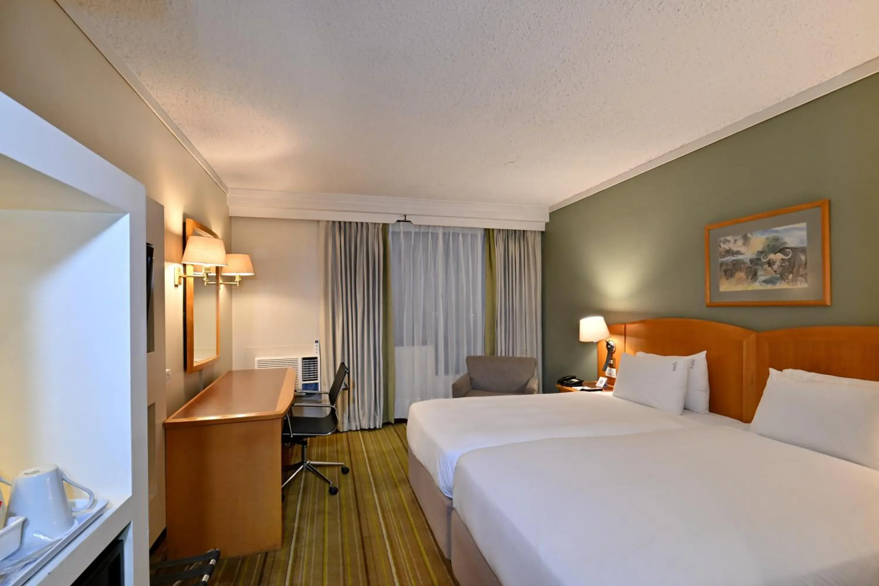 Bedroom, Bed in Holiday Inn - Harare by IHG Bedroom, Bed in Holiday Inn - Harare by IHG