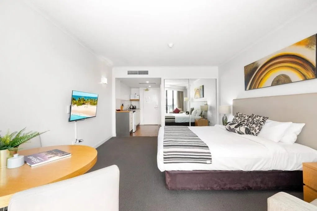 Bed in Cosmo Apartment Hotel