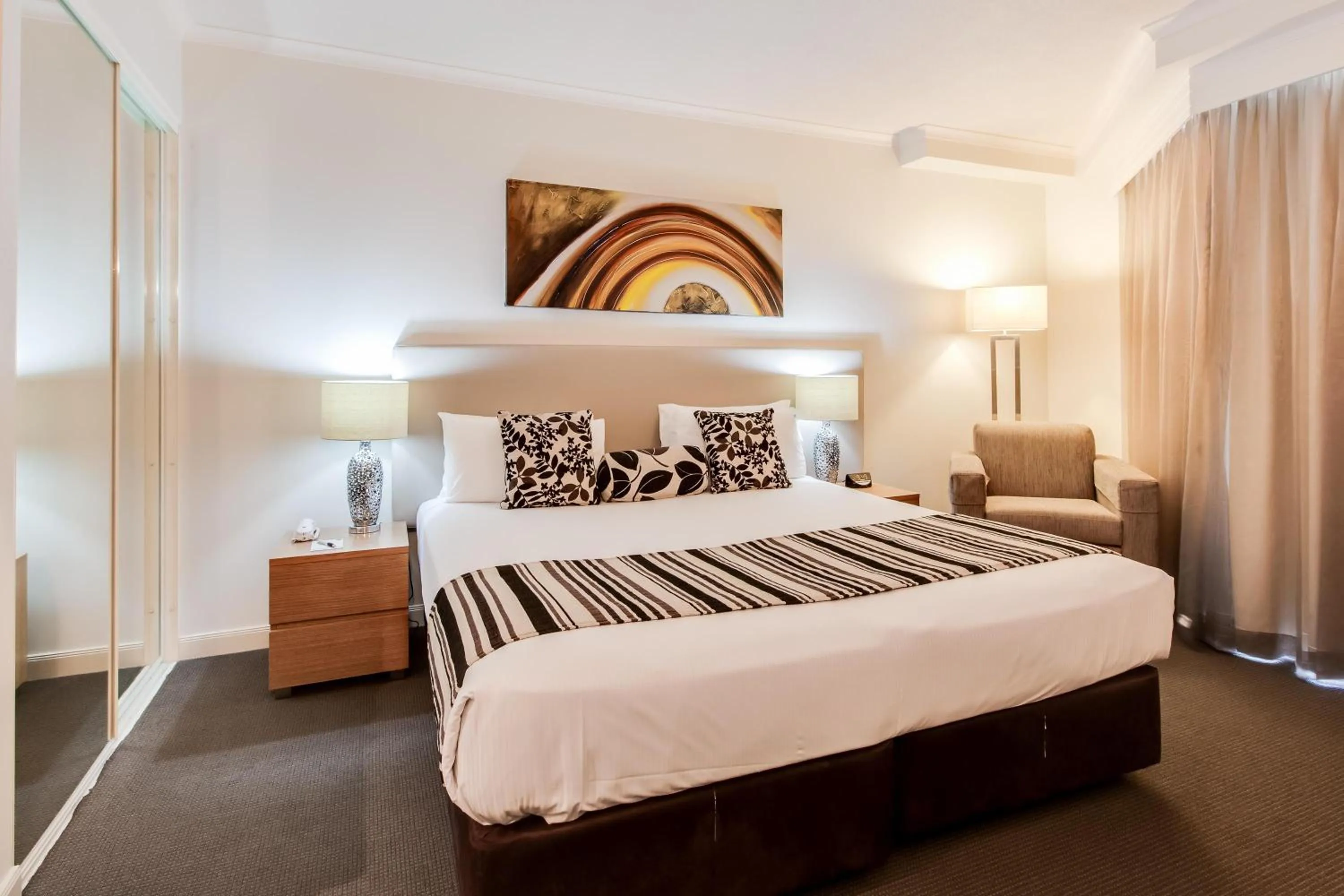 Bed in Cosmo Apartment Hotel