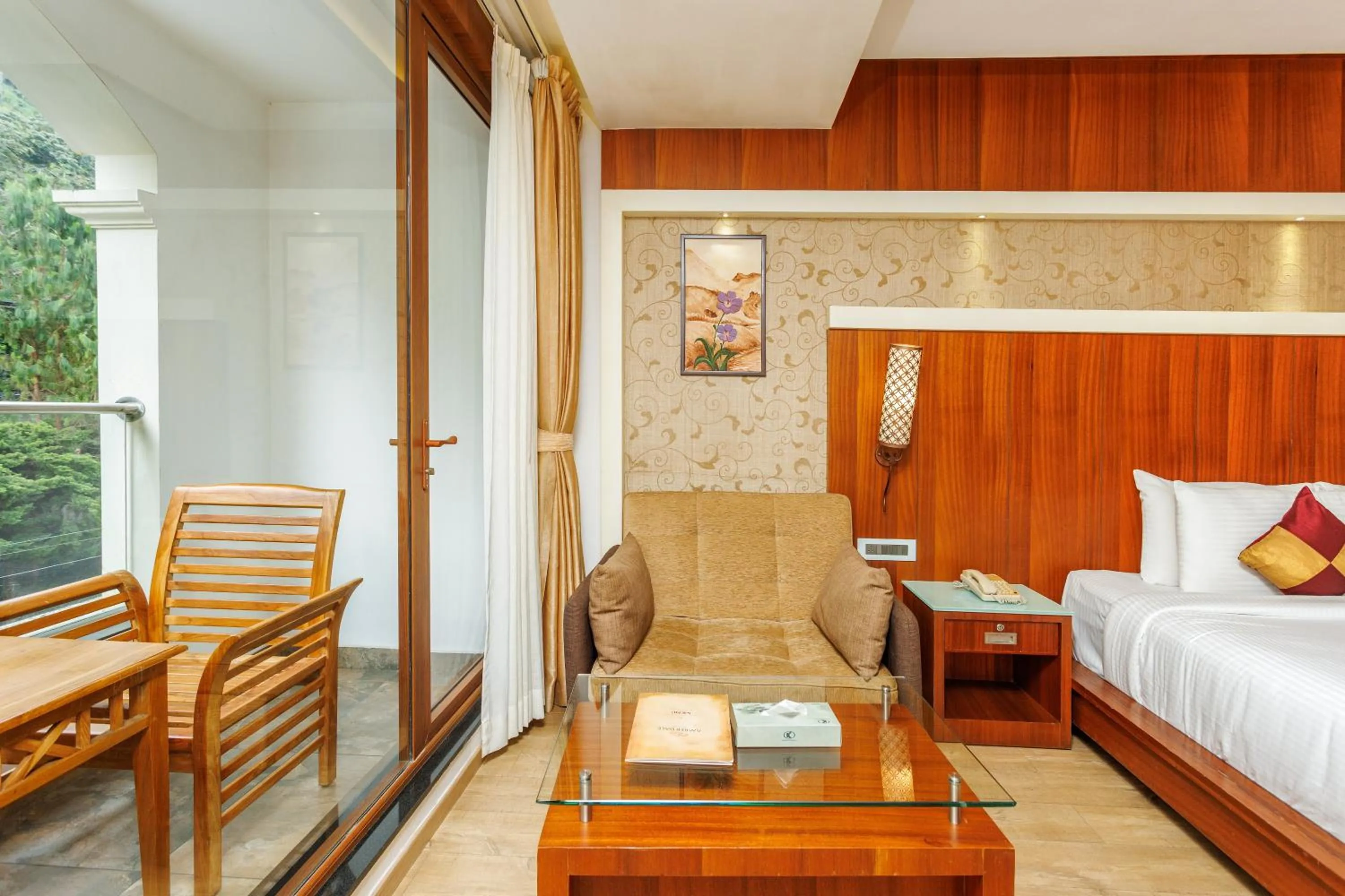 Seating area, Bed in Amber Dale Luxury Hotel & Spa, Munnar