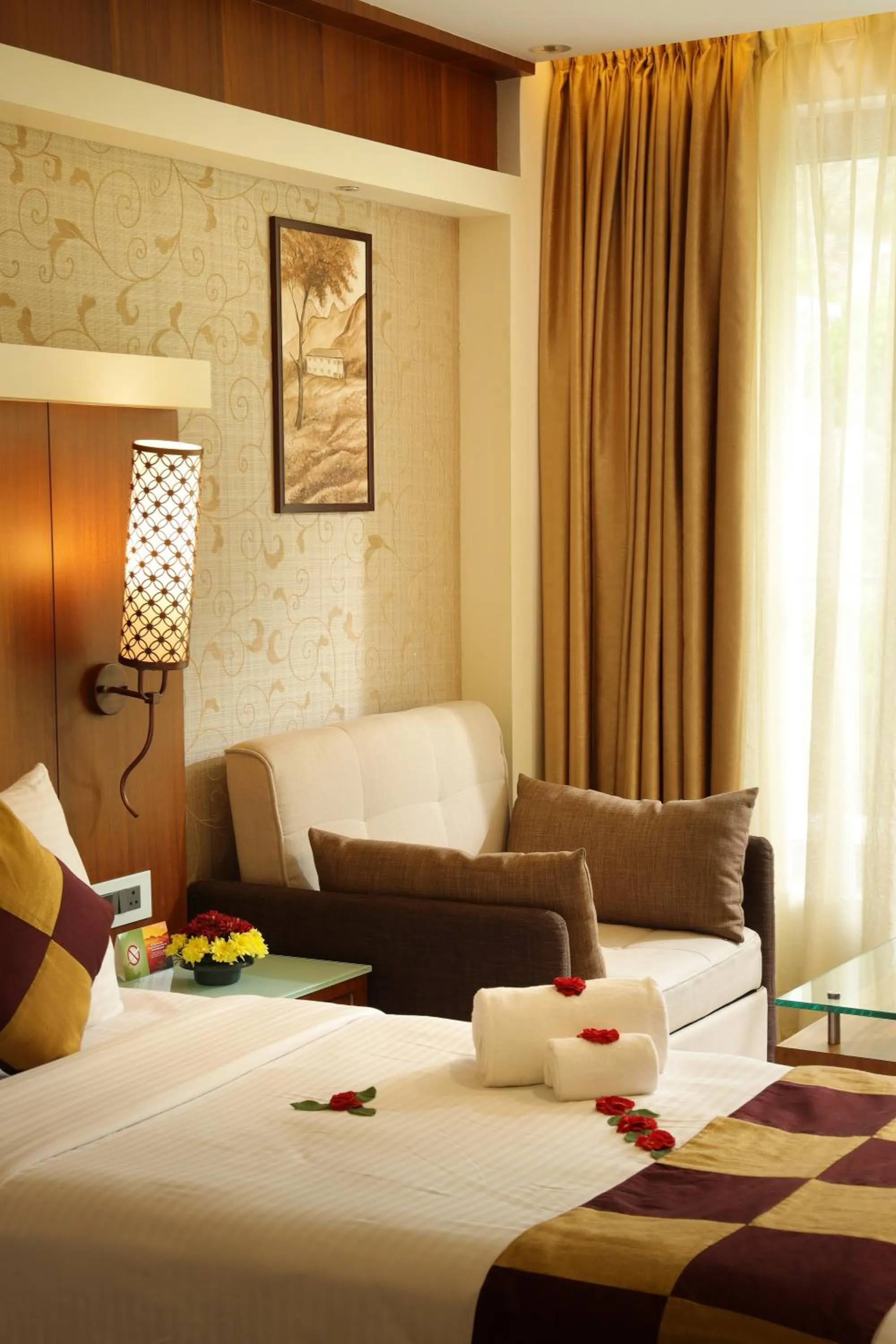 Seating area, Bed in Amber Dale Luxury Hotel & Spa, Munnar