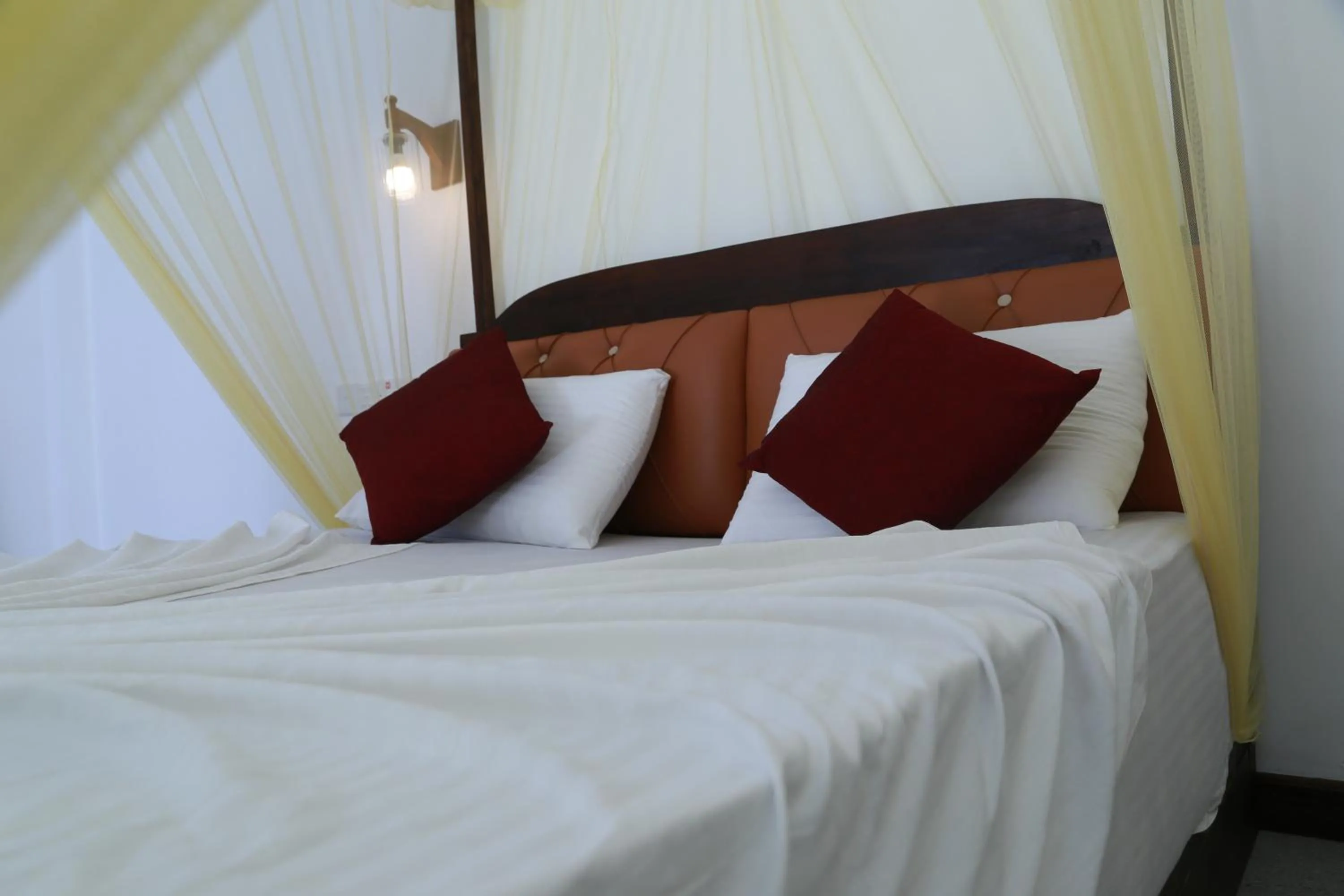 Bed in The Grand Yala Hotel