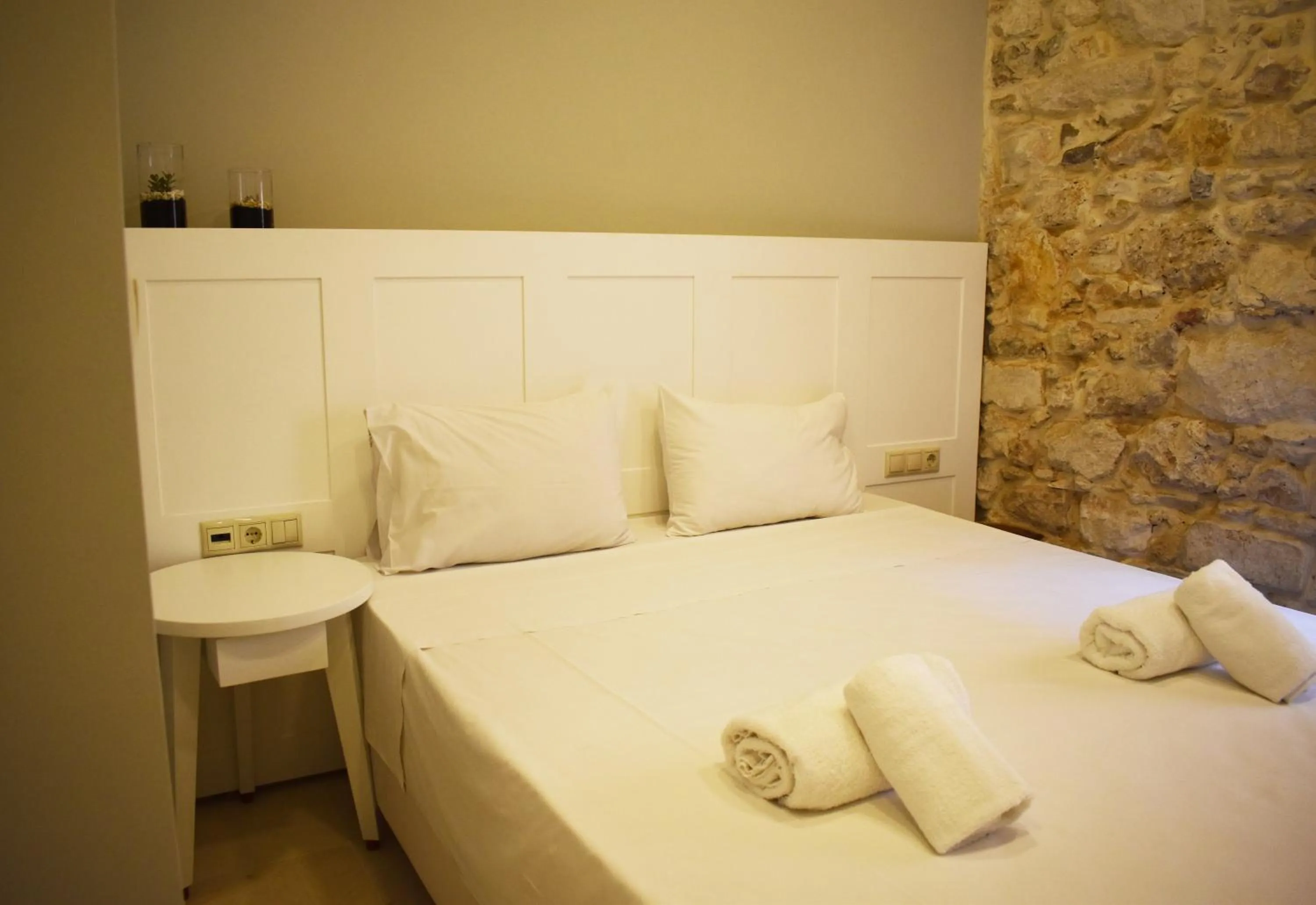 Bed in Candia Suites & Rooms