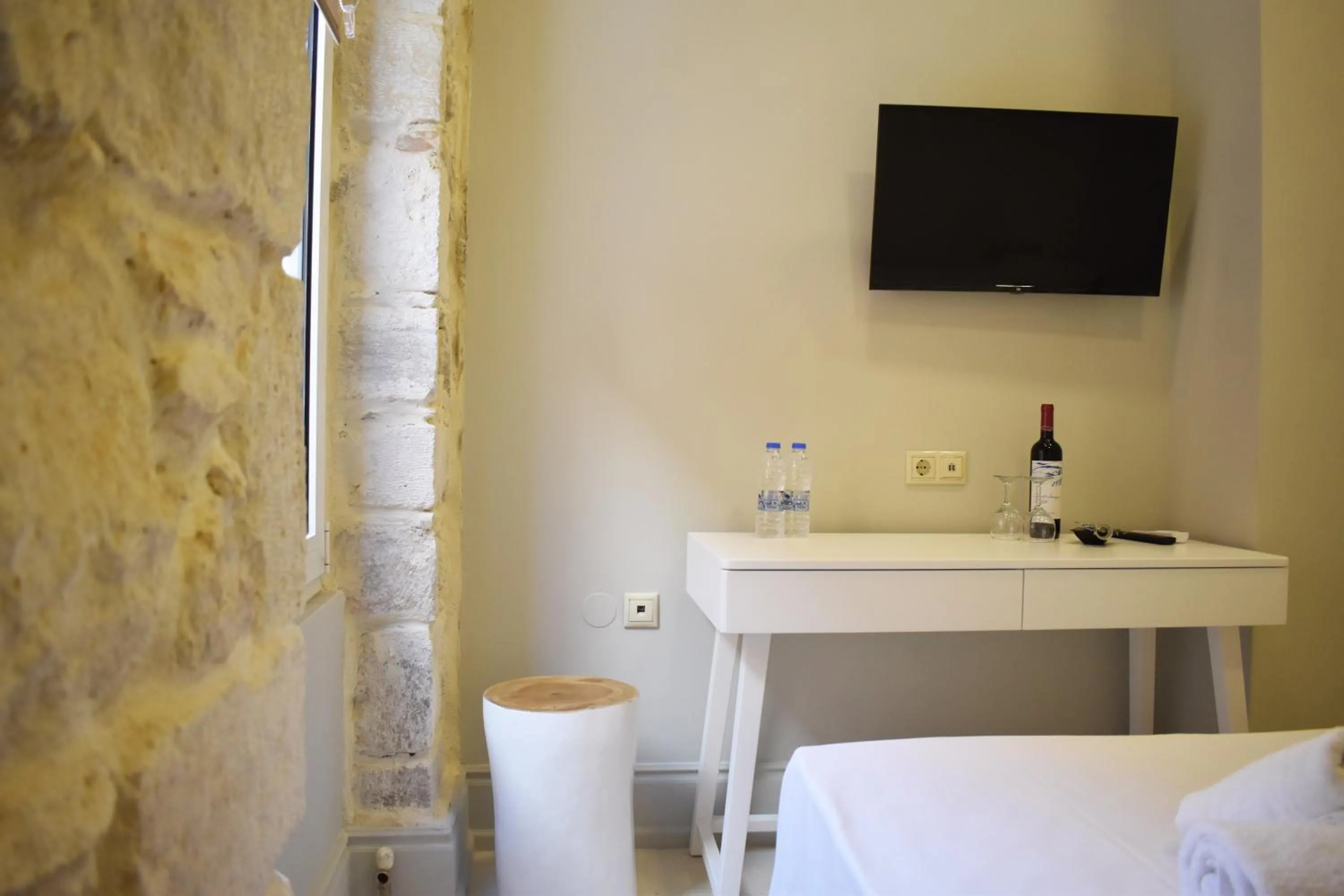 Bed in Candia Suites & Rooms