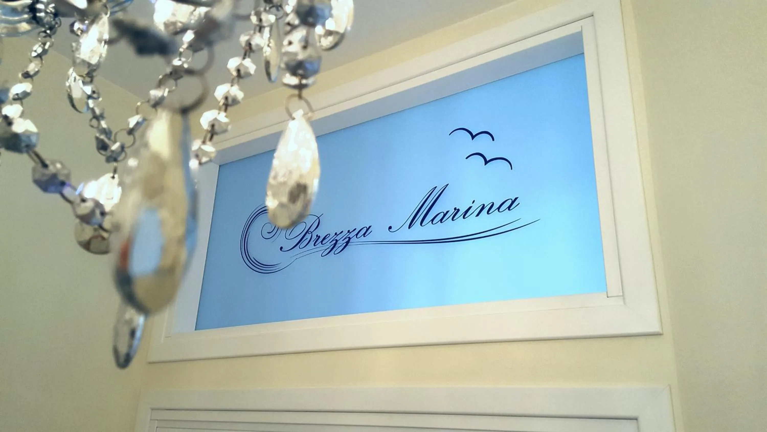 Property logo or sign in Brezza Marina Luxury Rooms
