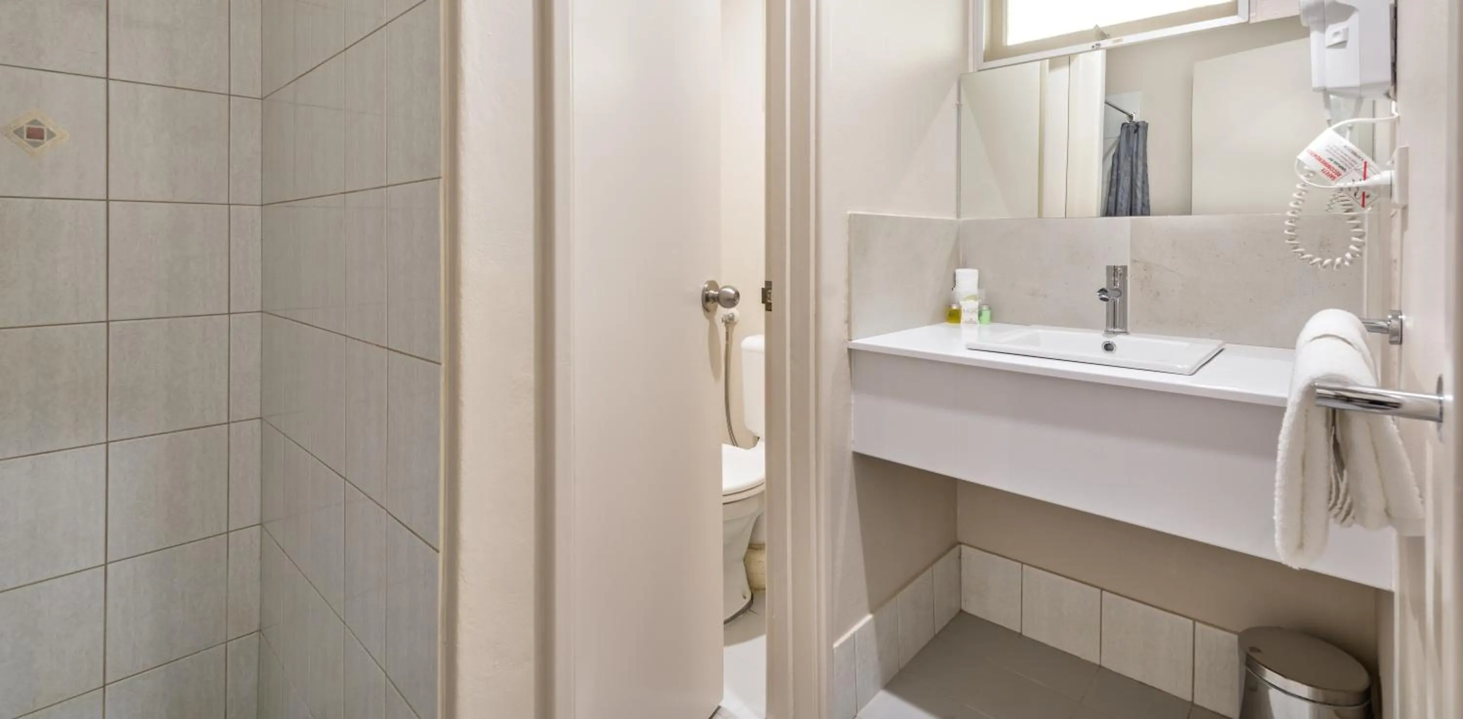 Toilet in Mandala Ace Albany Hotel