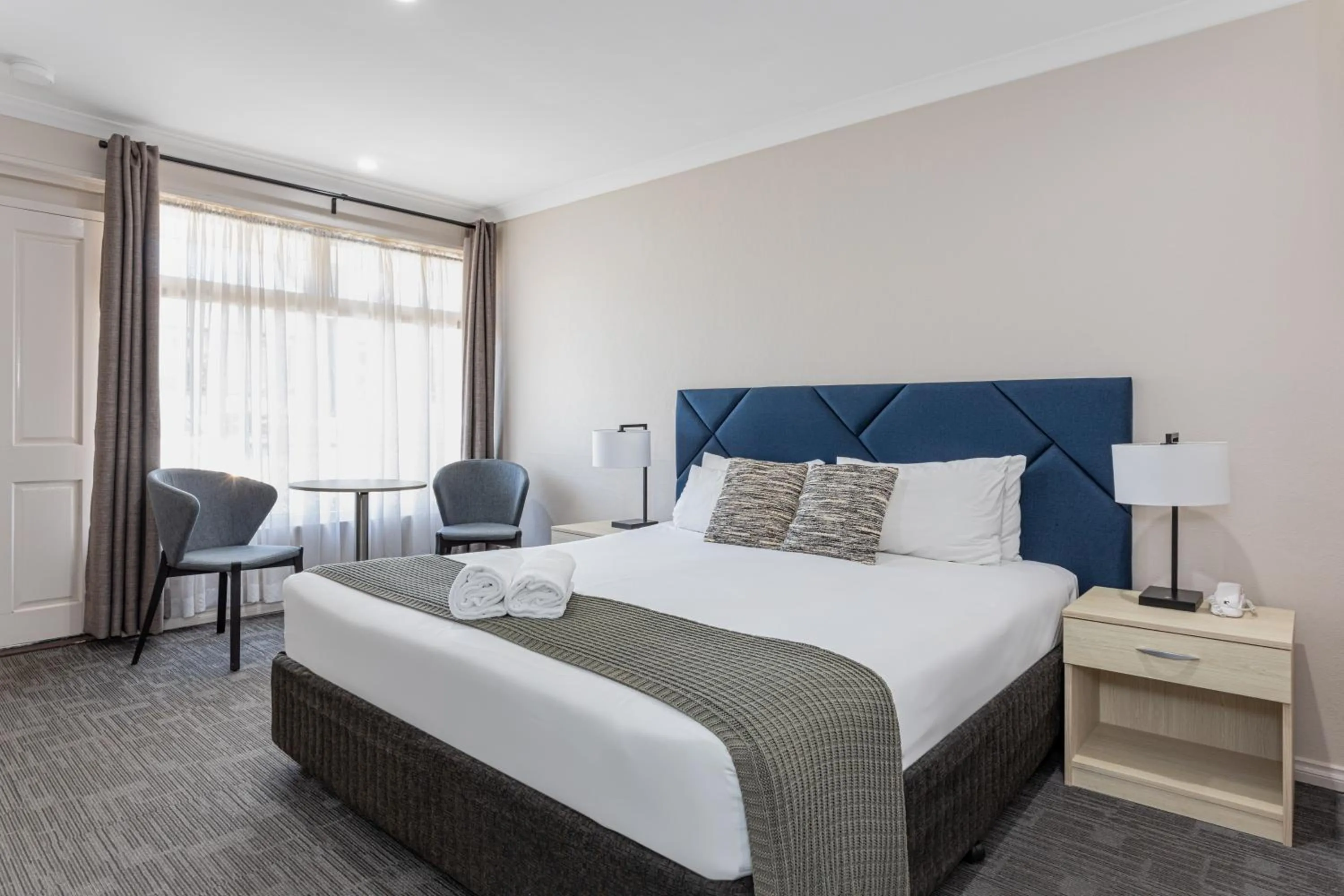 Toilet, Bed in Mandala Ace Albany Hotel