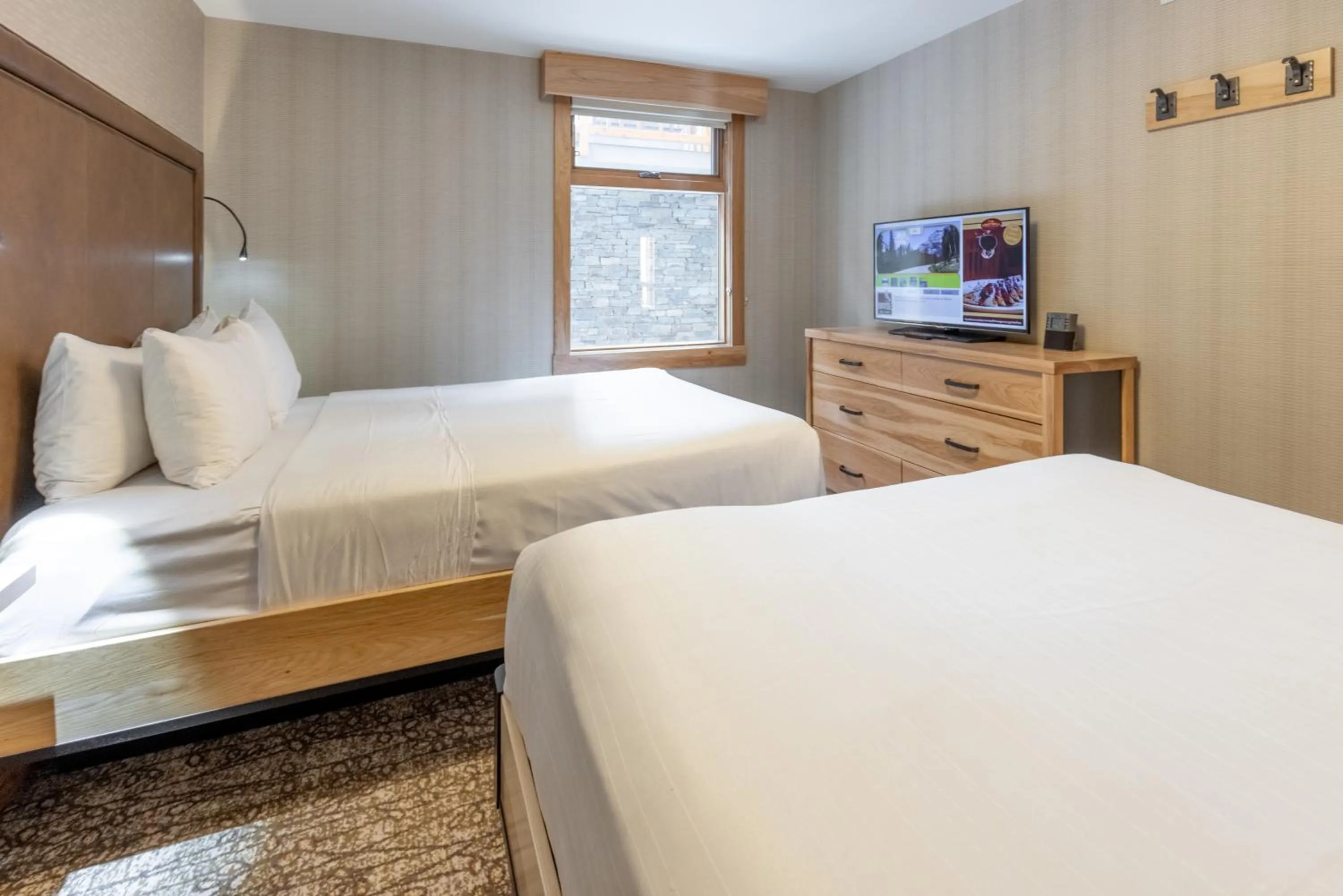 Bed in Moose Hotel and Suites