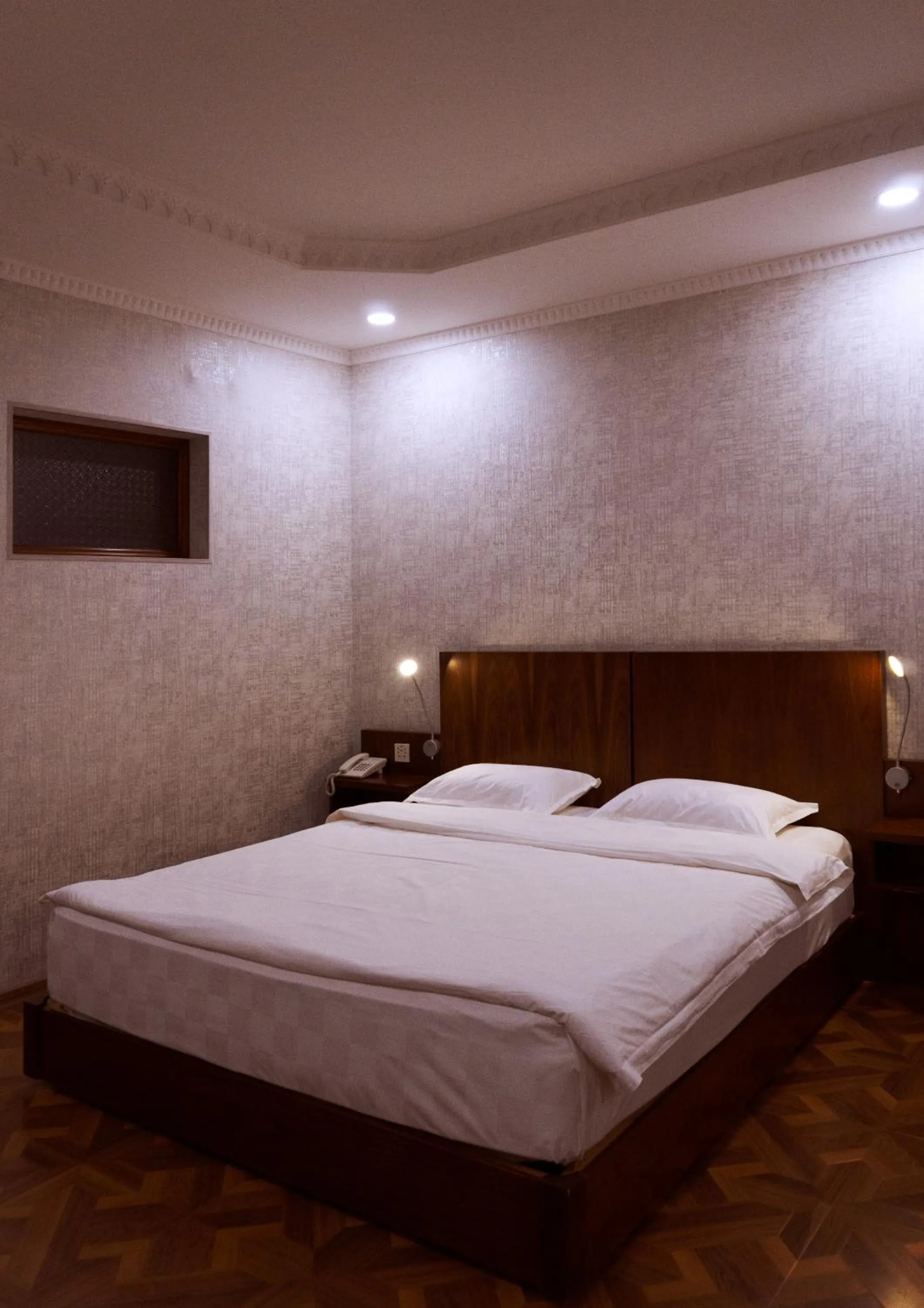 Bed in Omar Khayyam Hotel