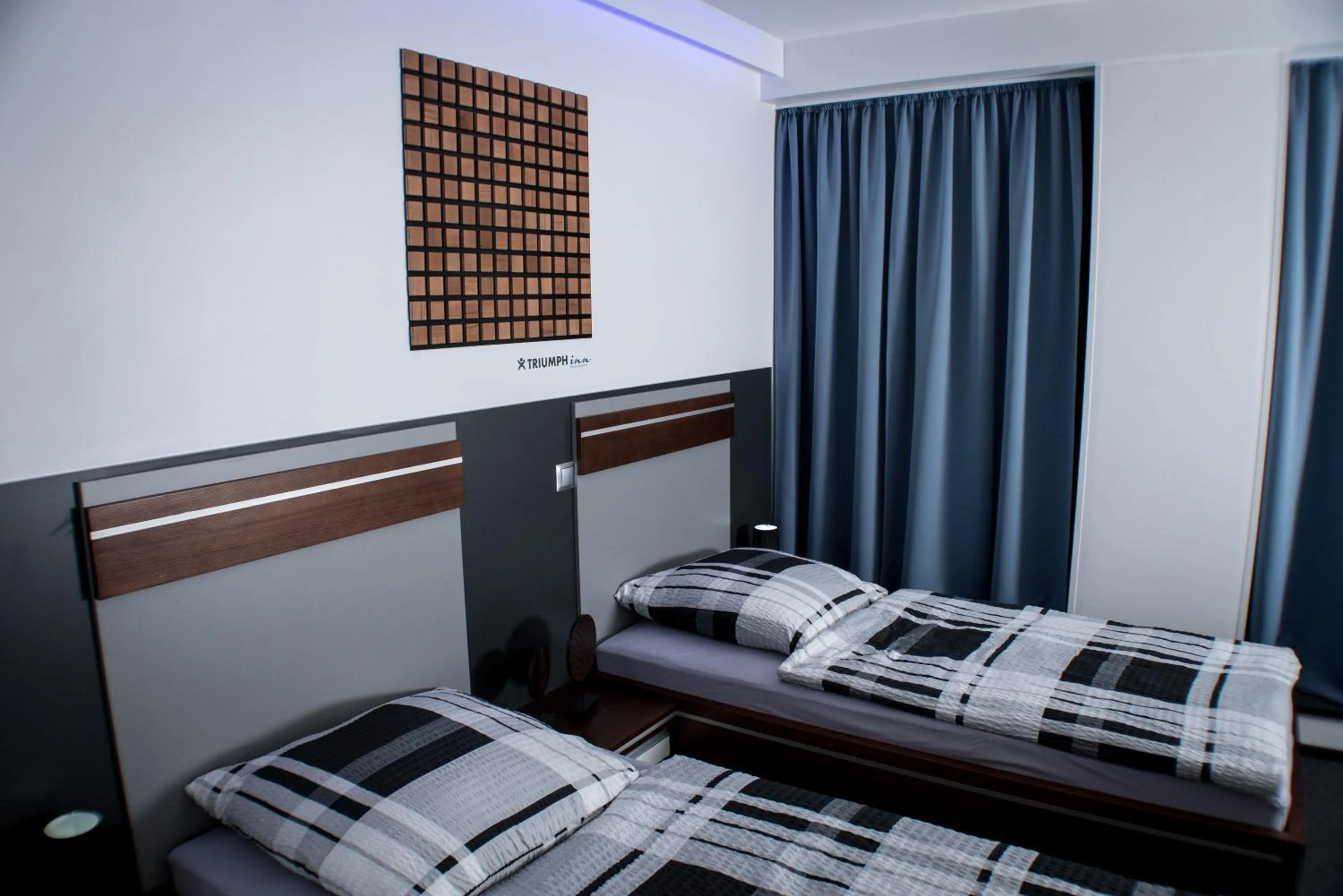 Bed in Triumph Inn Pension