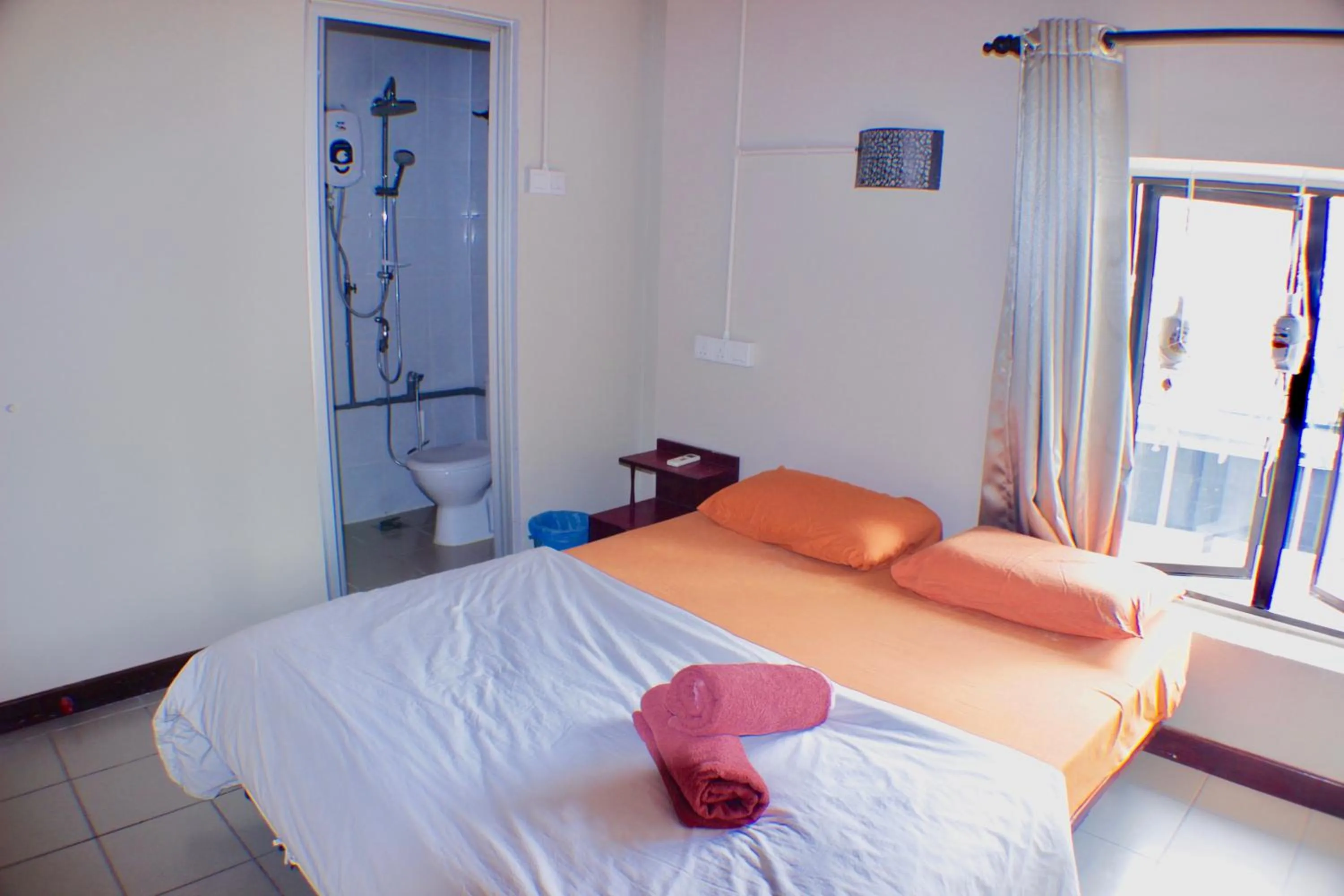 Bed in Birdnest Guesthouse, Gaia Rooftop Cafe