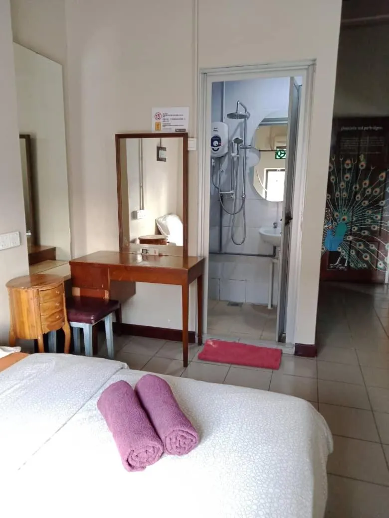 Bed in Birdnest Guesthouse, Gaia Rooftop Cafe