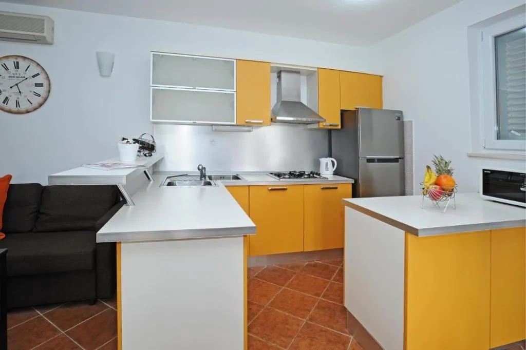 Kitchen or kitchenette in Holiday Home Odiseja