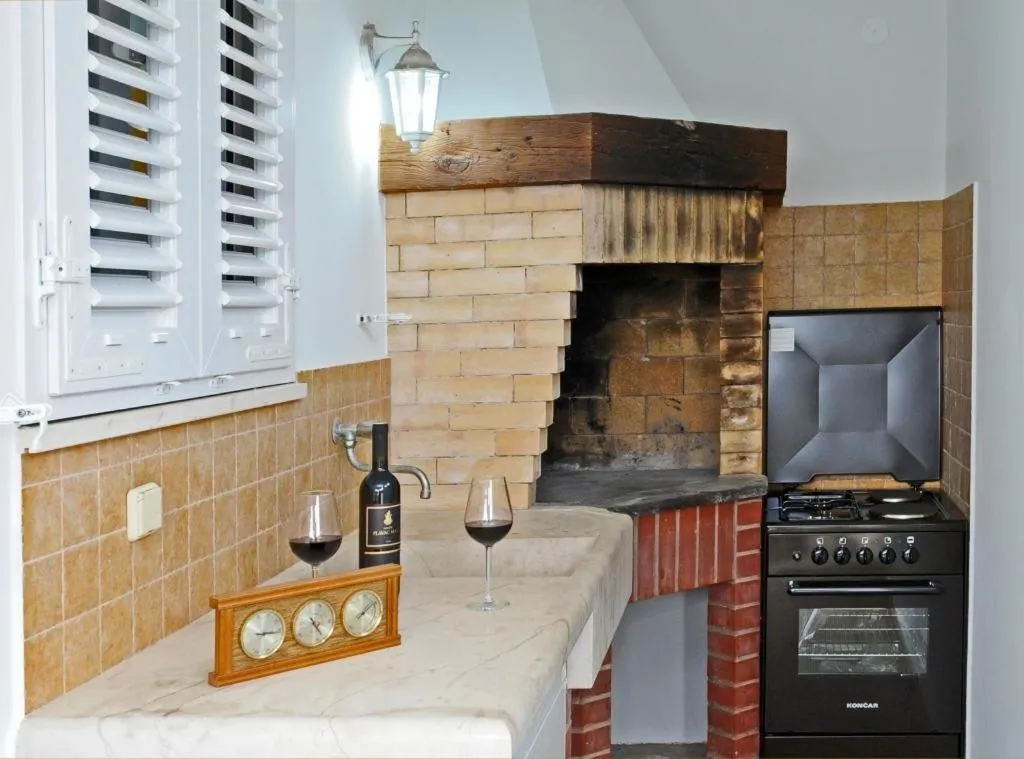 Kitchen or kitchenette in Holiday Home Odiseja