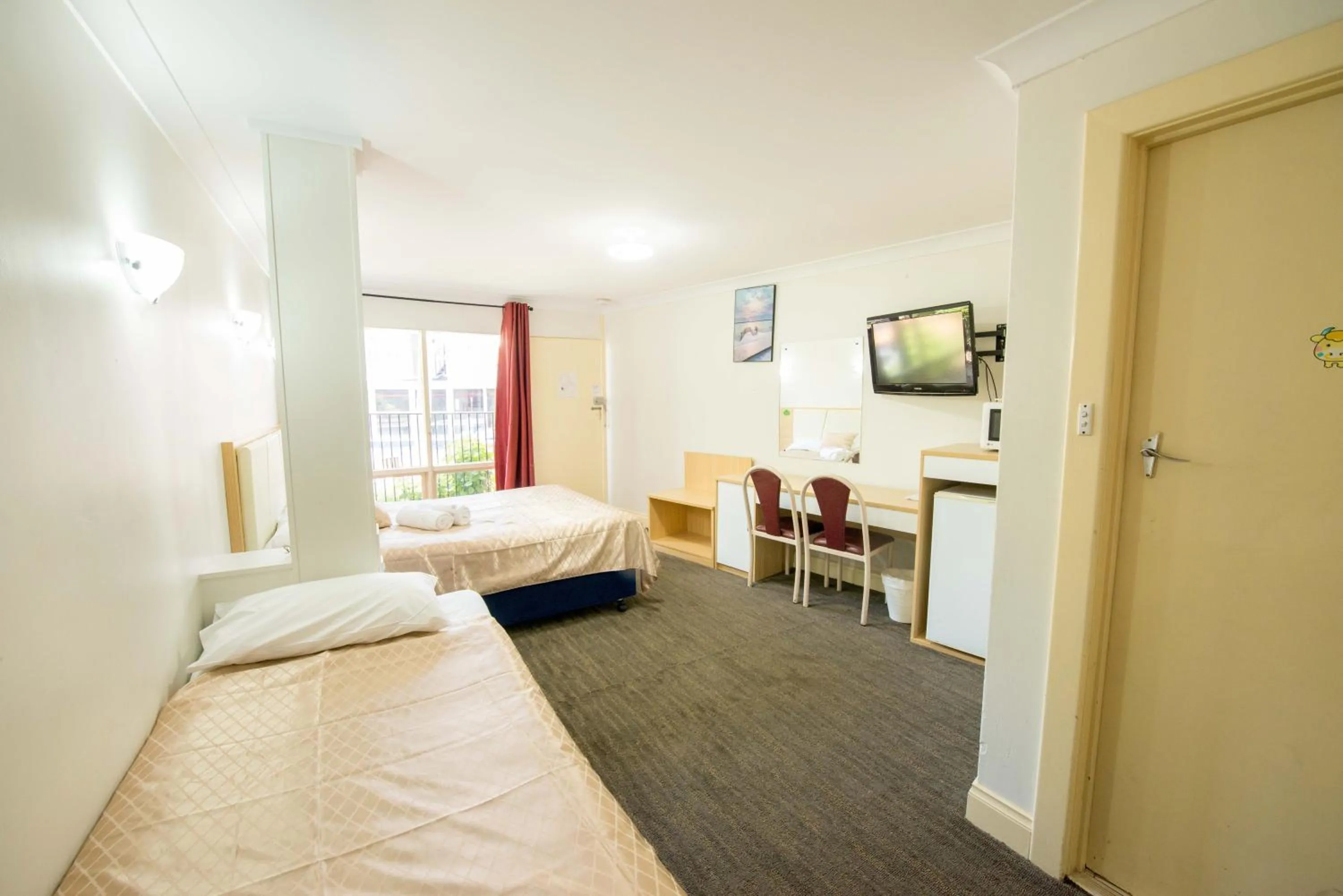 Bed in Jacksons Motor Inn