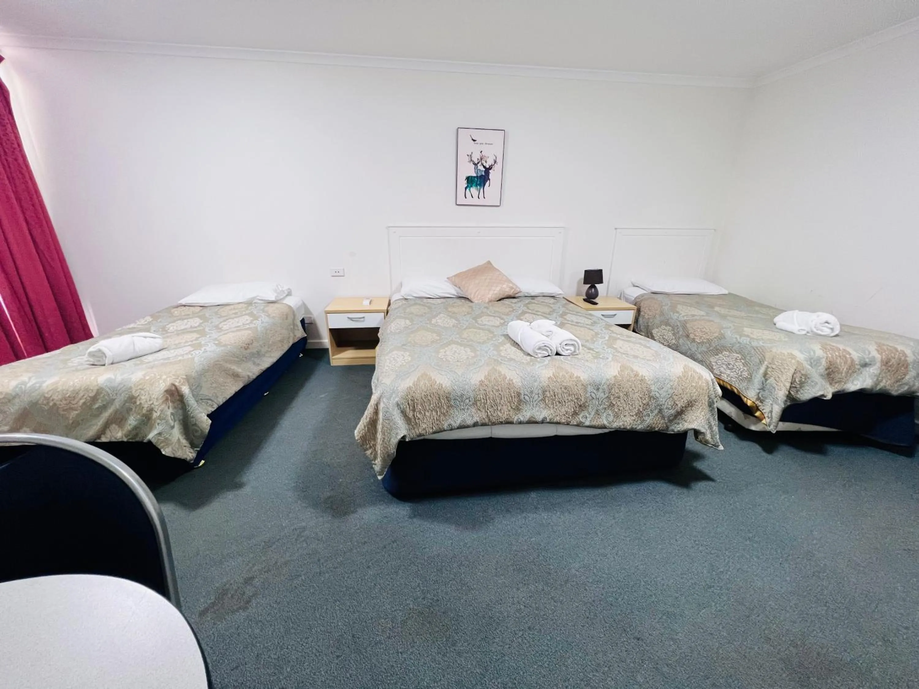 Bed in Jacksons Motor Inn