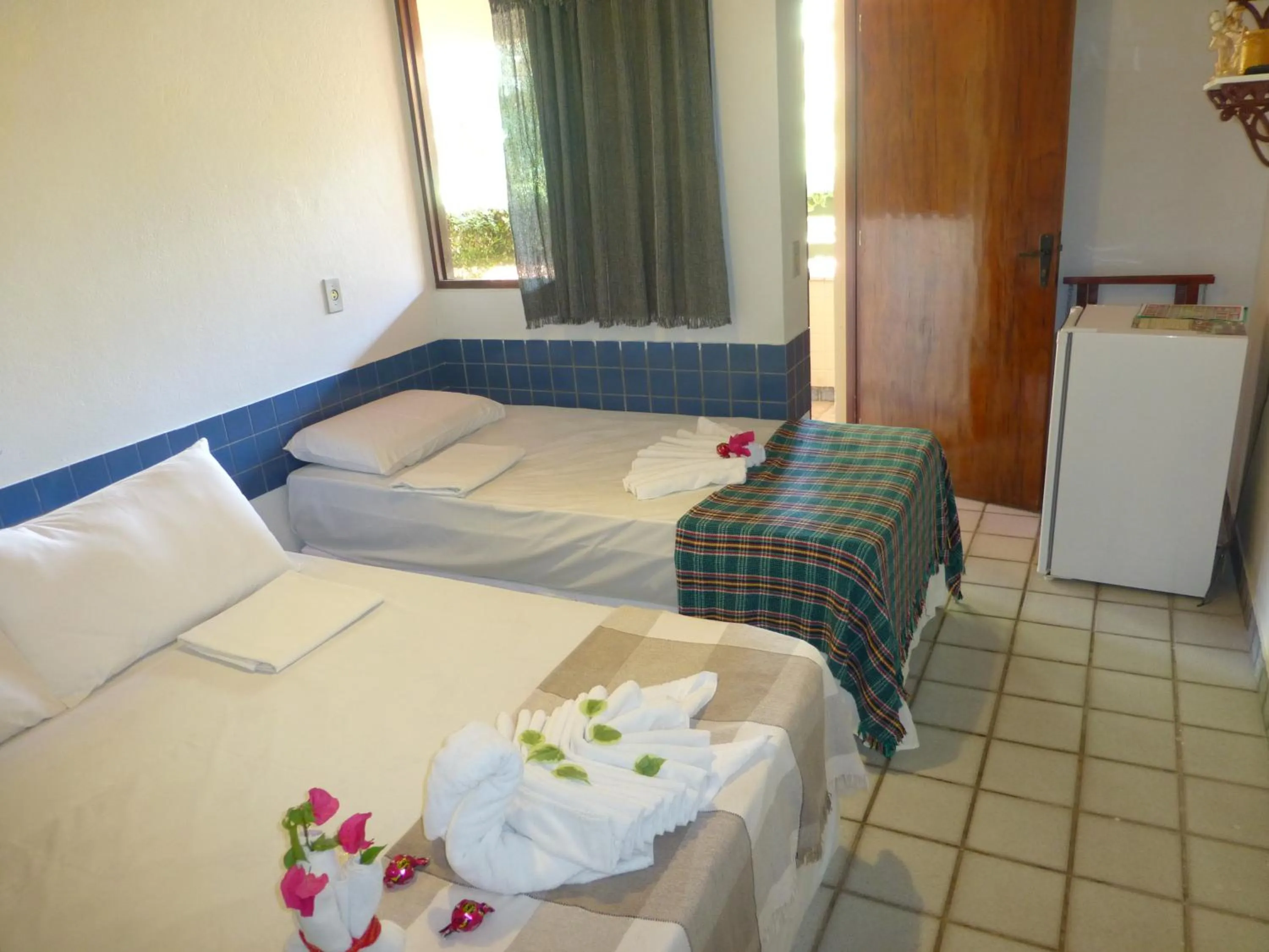 Bed in Pousada das Bromélias