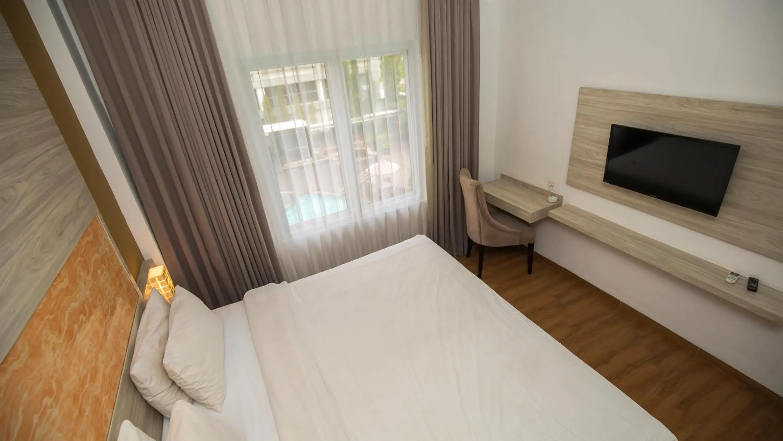 Bed in Front One Akshaya Hotel Karawang Bed in Front One Akshaya Hotel Karawang