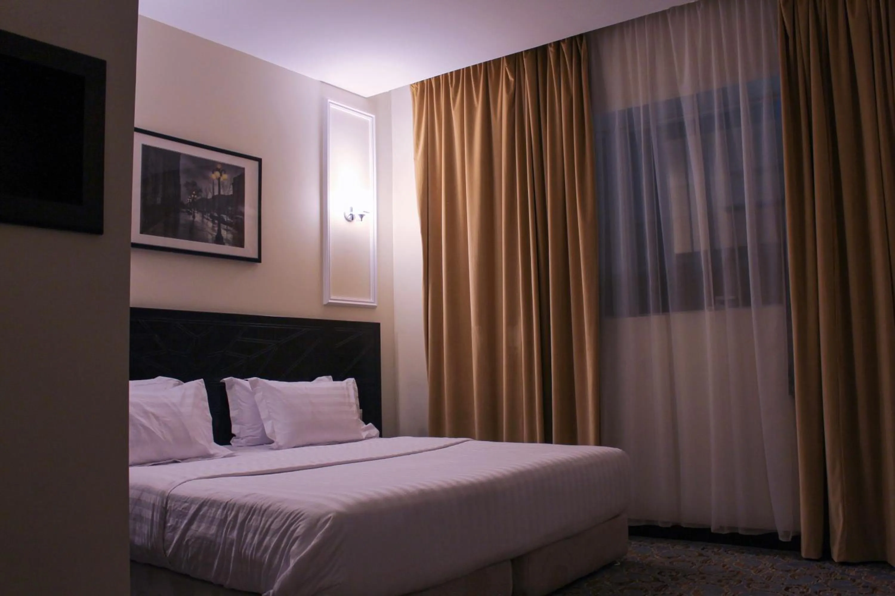 Bed in Rollins Hotel