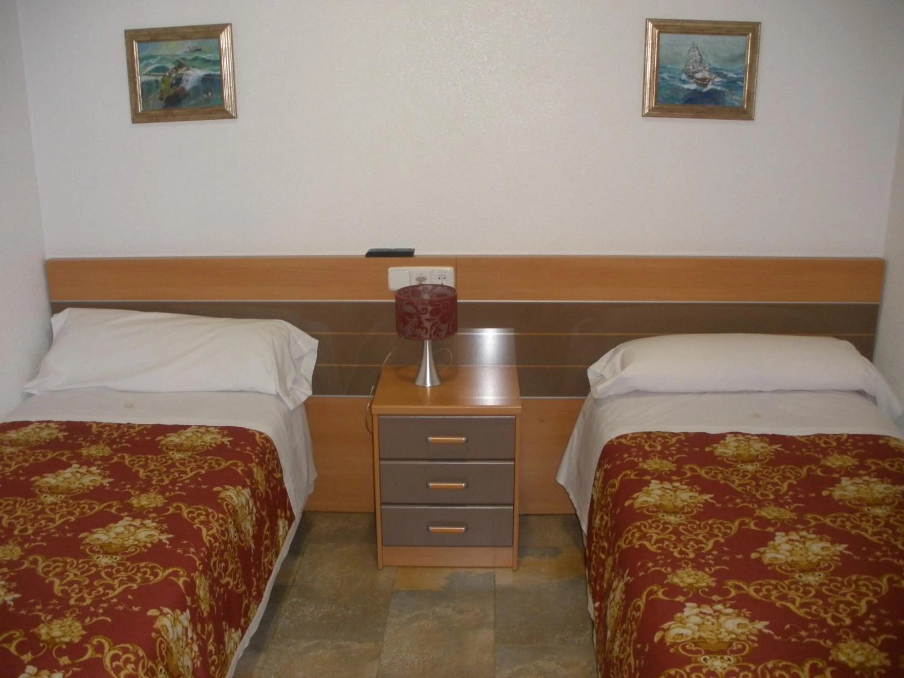 Bed in Hostal del Pez Azul