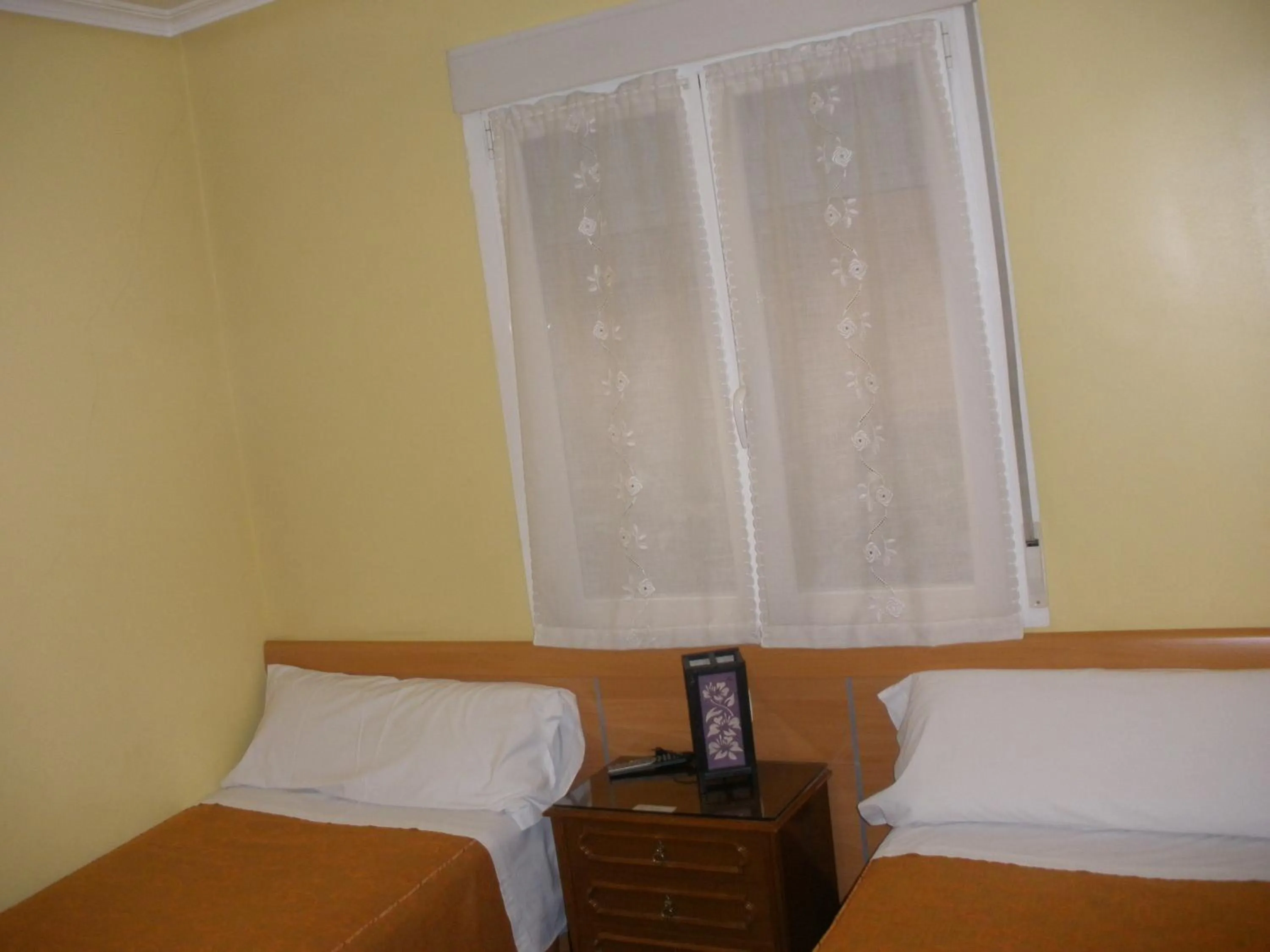 Bed in Hostal del Pez Azul