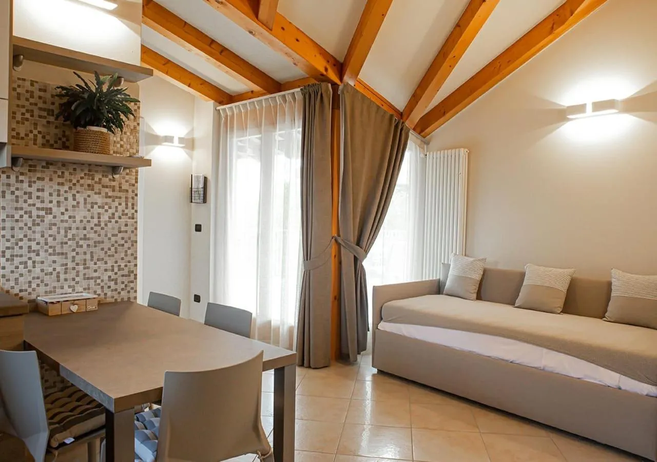 Living room, Bed in Sirmione Rosselli Apartments
