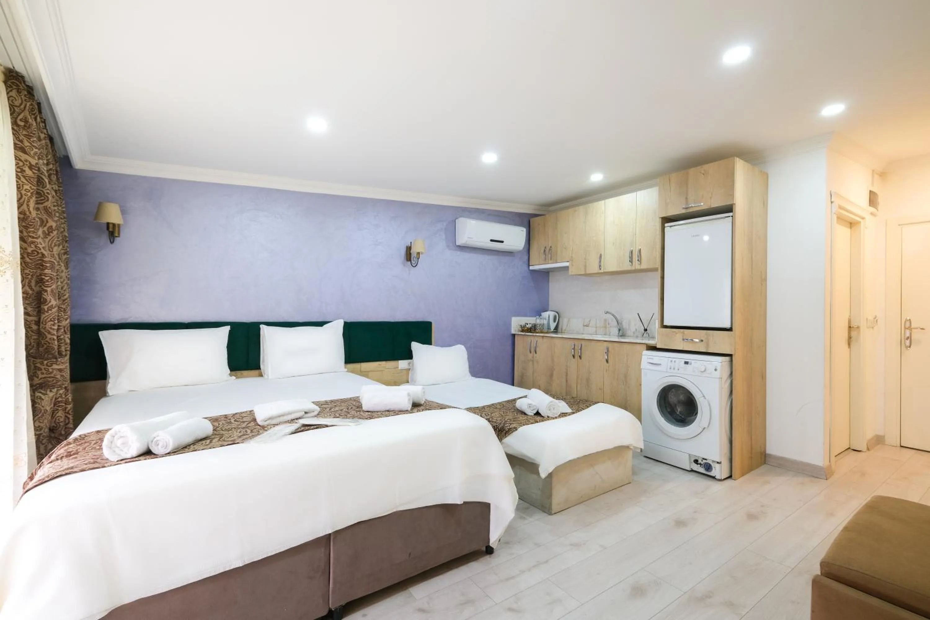 Bed in Loren Hotel&Suites