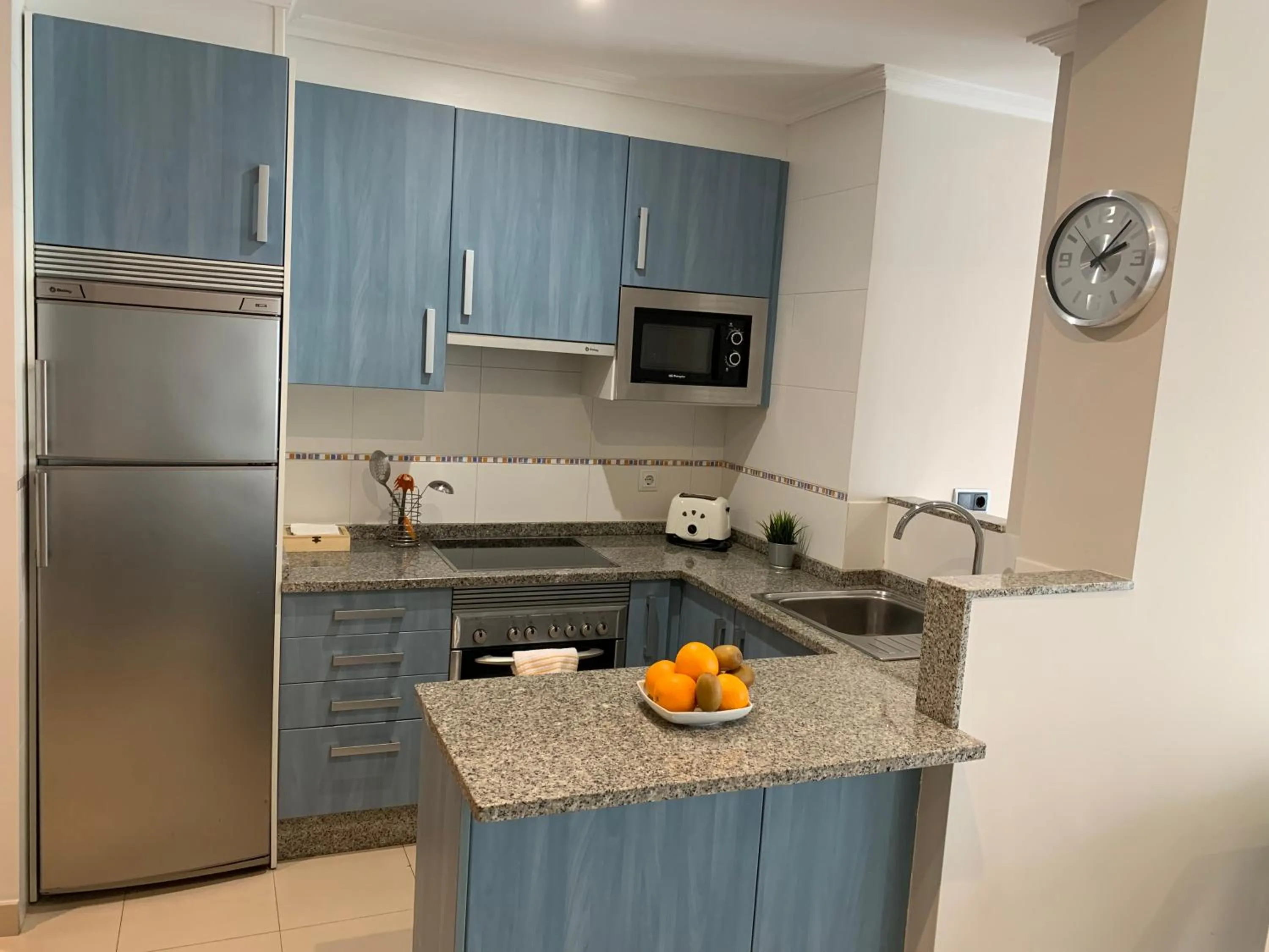 Kitchen or kitchenette in Apartamentos Arosa