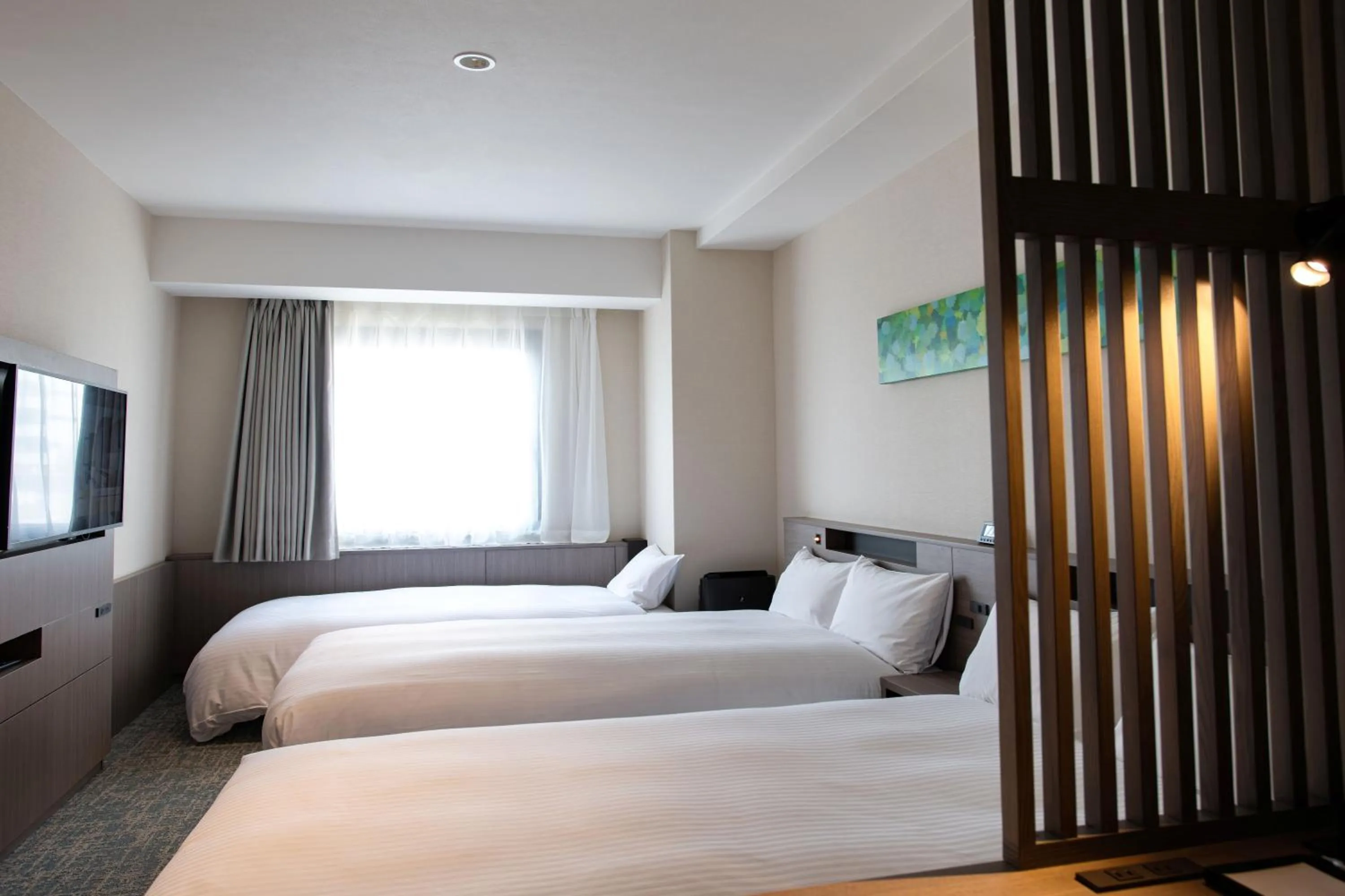 Bed in Hotel Emisia Tokyo Tachikawa