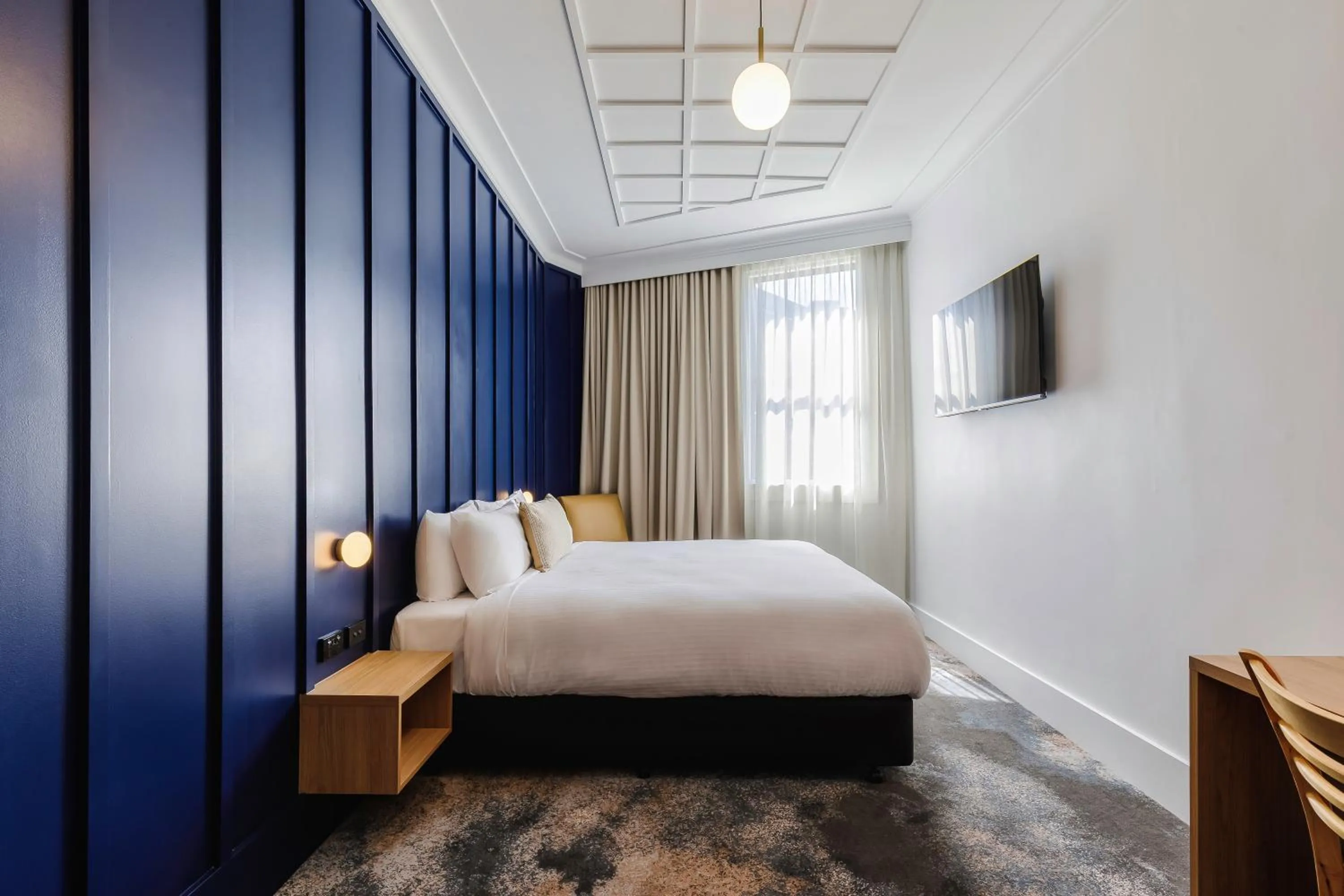 Bed in Royal Exhibition Hotel