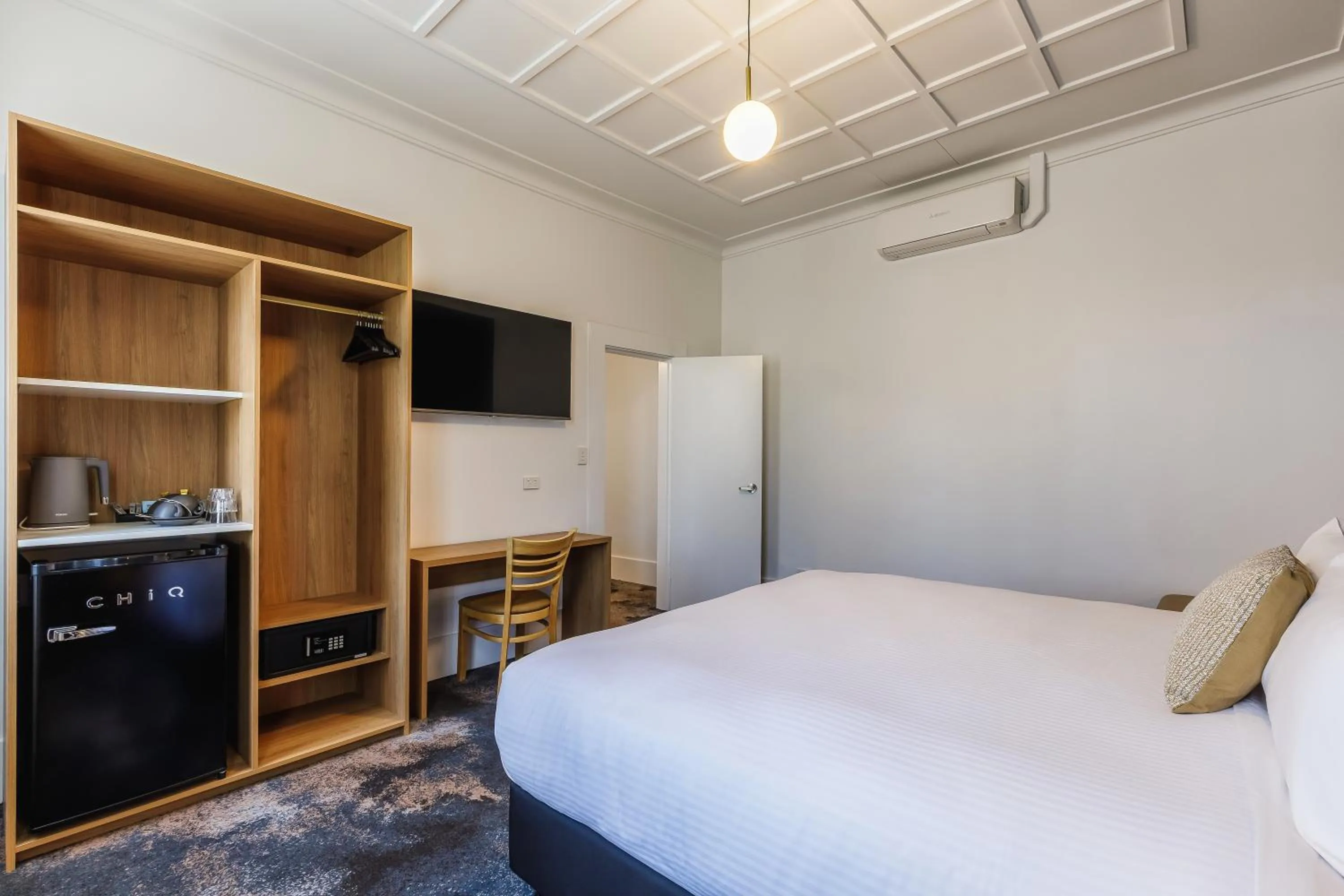 Bed in Royal Exhibition Hotel