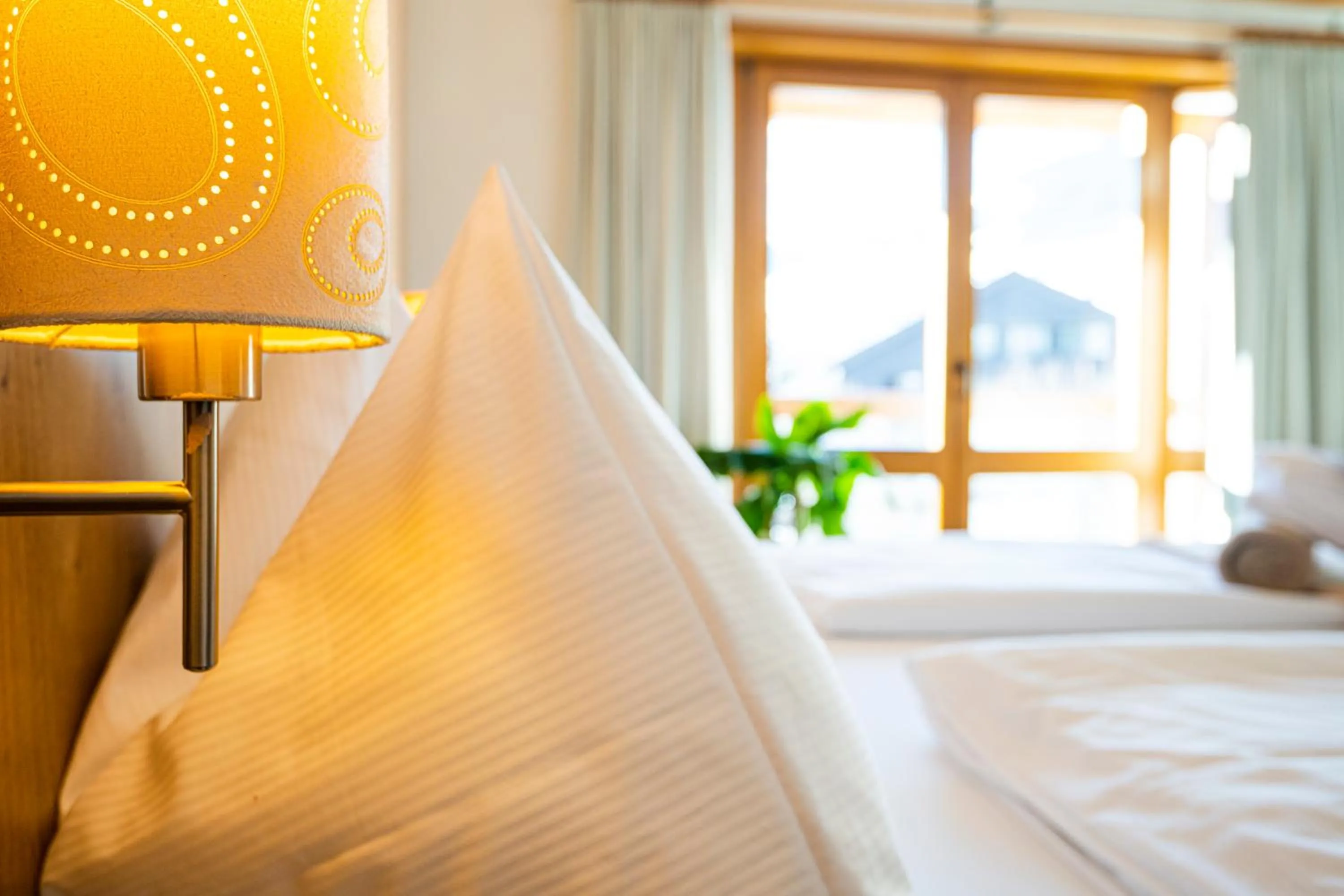 Photo of the whole room, Bed in Hotel Das Gastein - ganzjährig inklusive Alpentherme Gastein & Sommersaison inklusive Gasteiner Bergbahnen