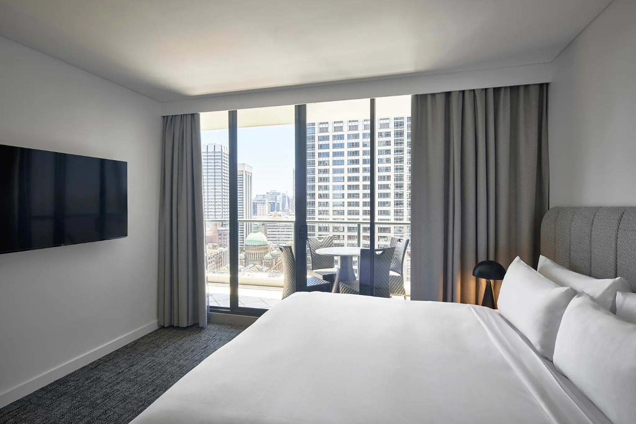 Bed in Meriton Suites Pitt Street, Sydney