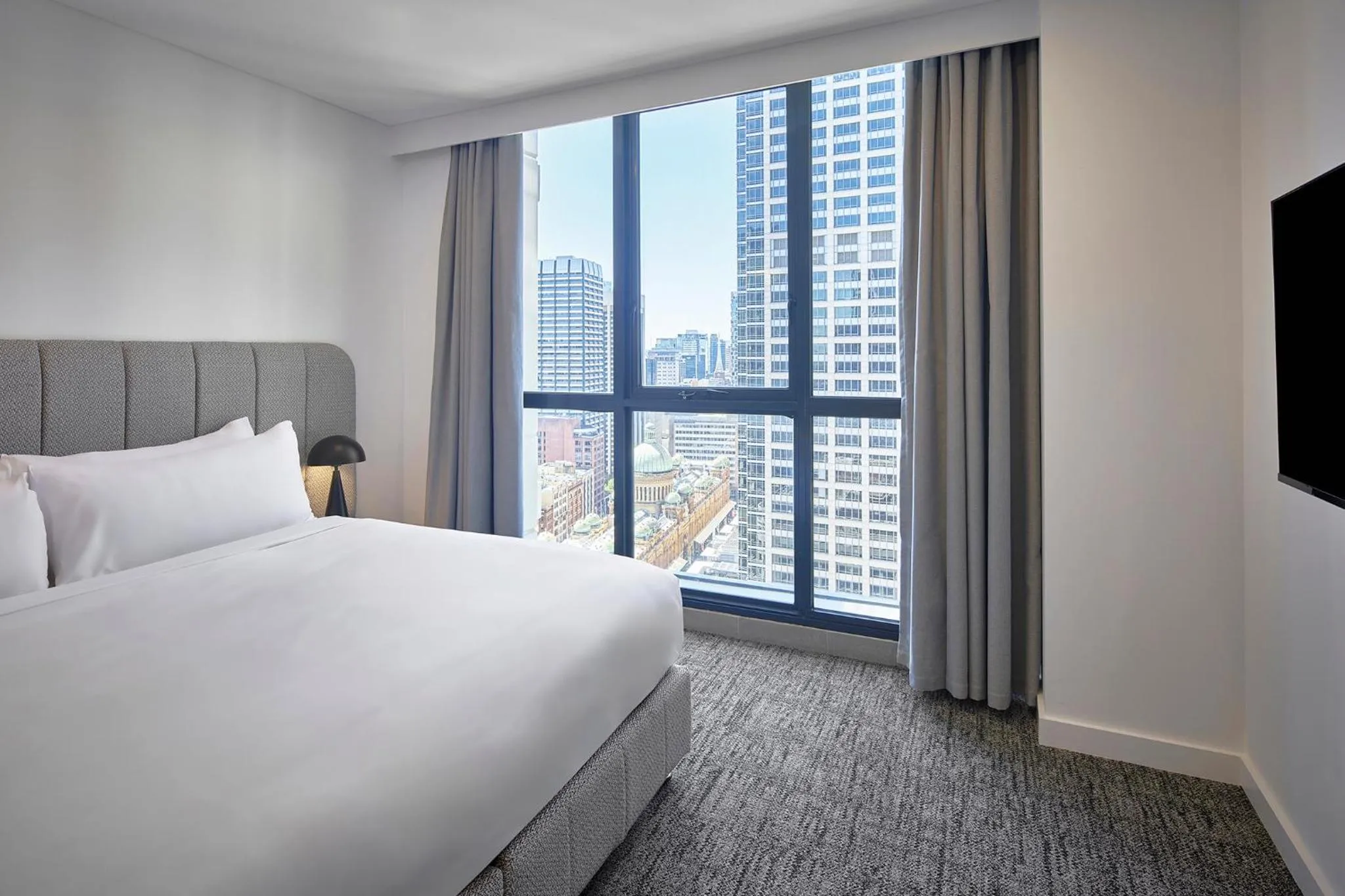 Bed in Meriton Suites Pitt Street, Sydney