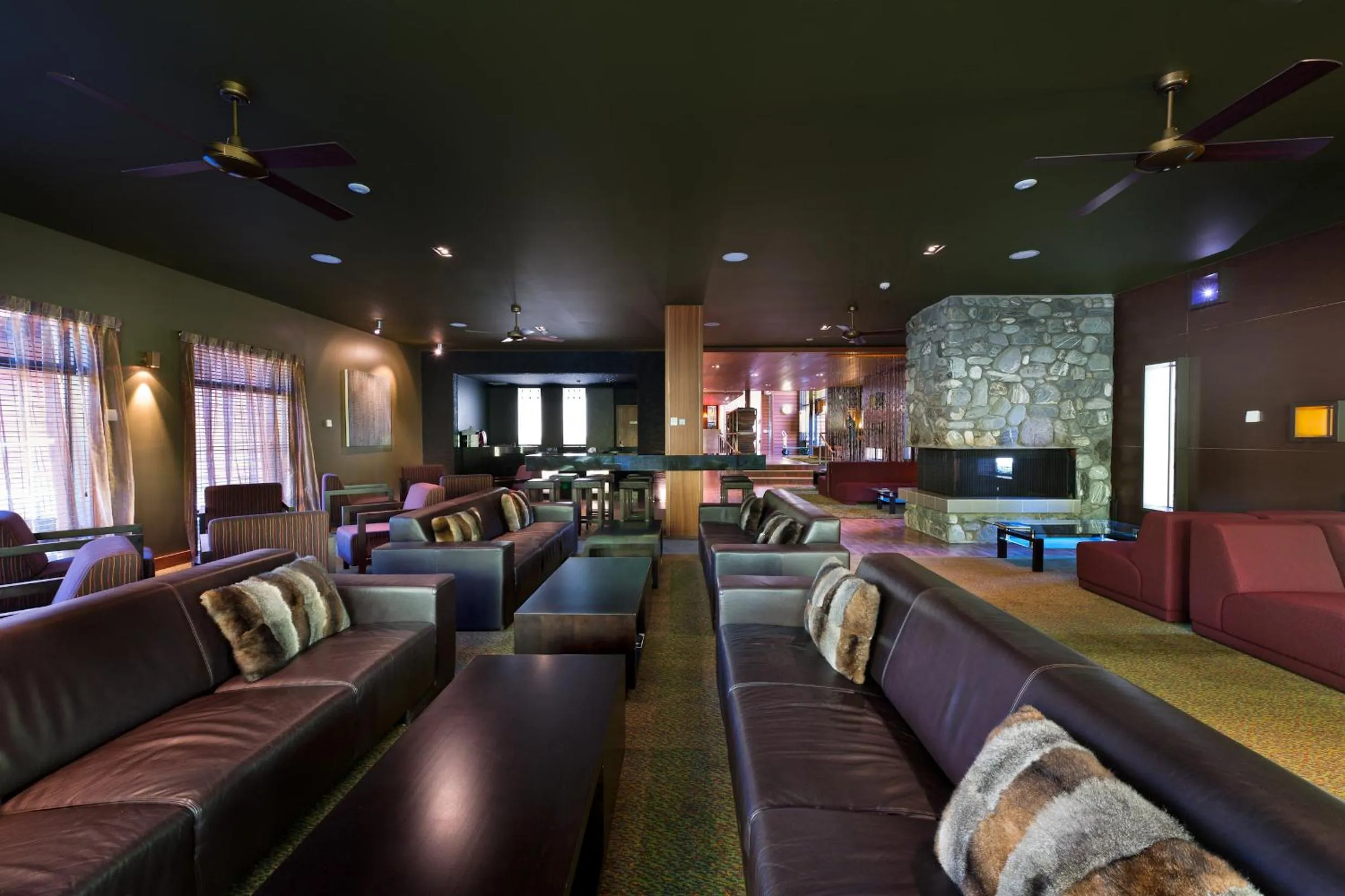 Communal lounge/ TV room in Legacy Te Waonui Hotel Franz Josef