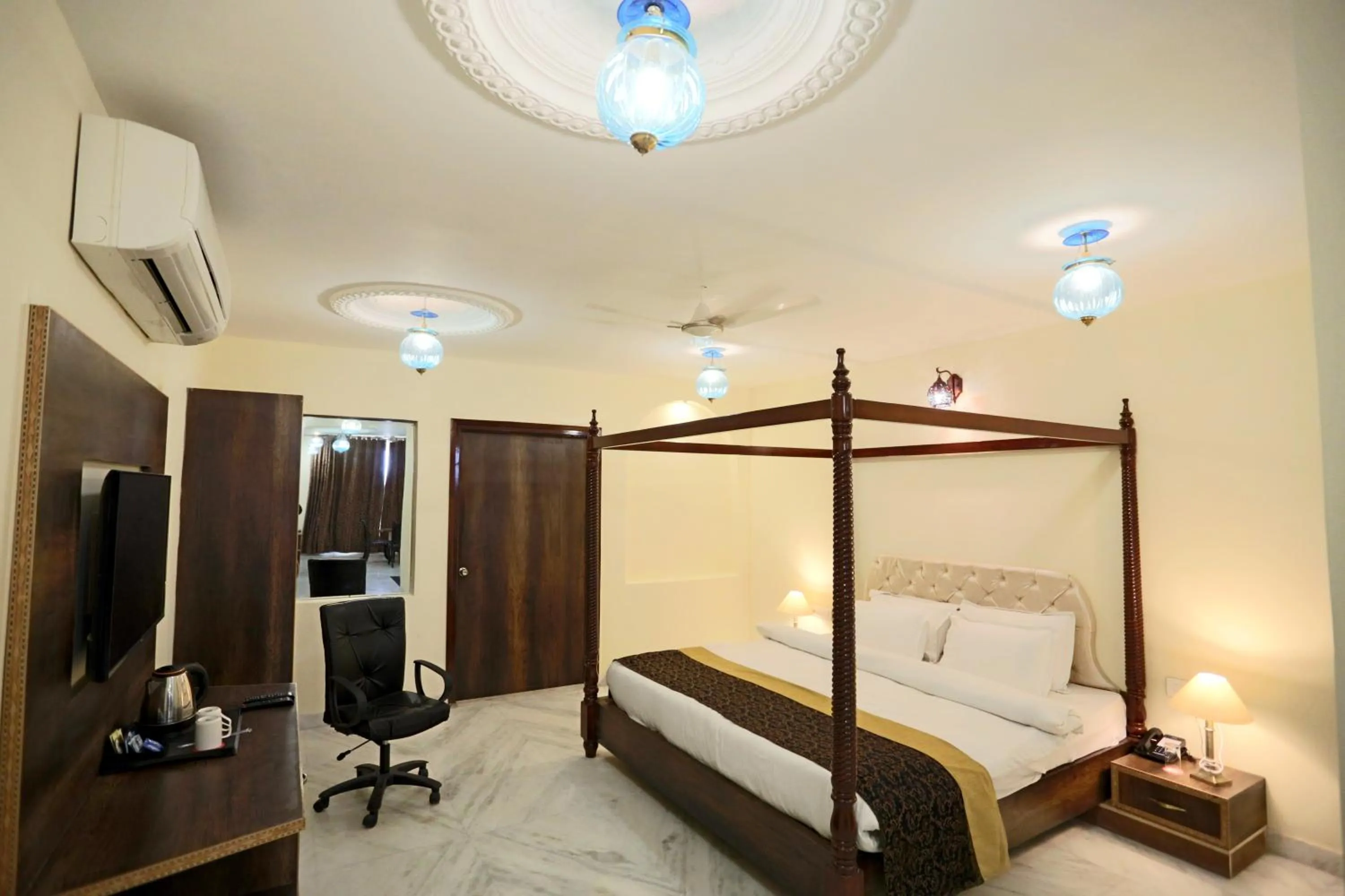 Photo of the whole room, Bed in Regenta Central Mewargarh, Near Biological park