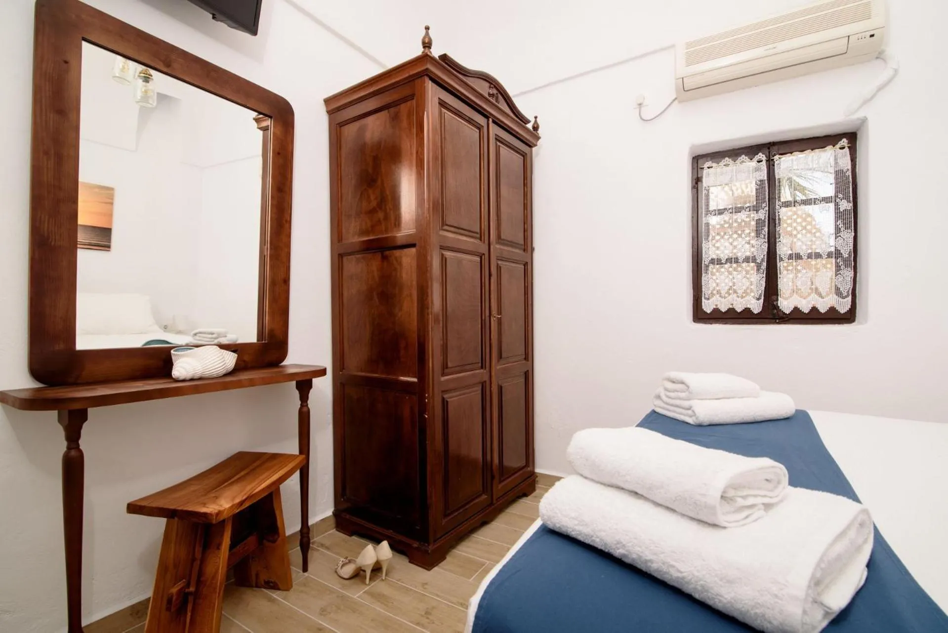 Decorative detail, Bed in Santorini Crystal Blue Boutique Hotel