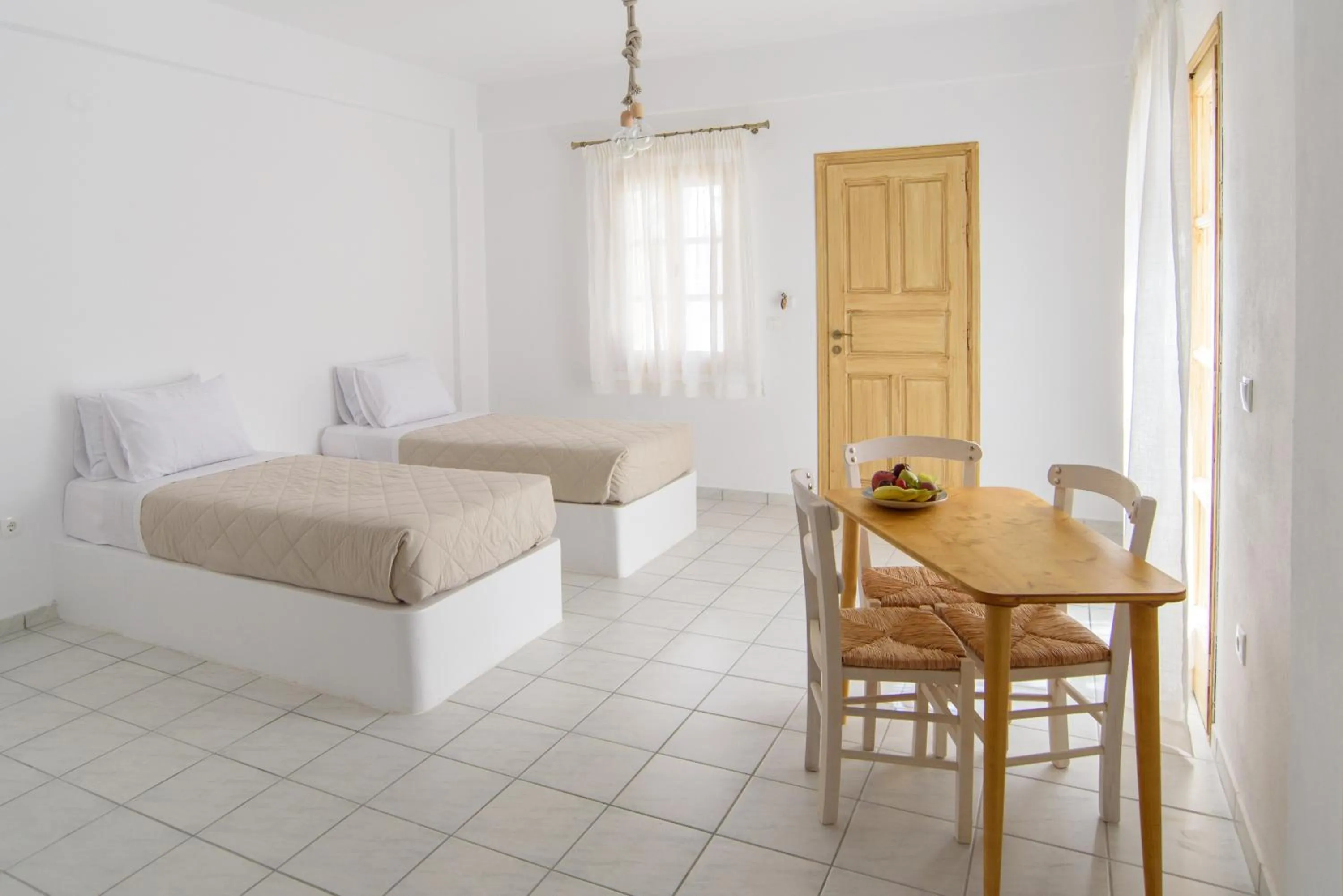 Living room, Bed in Santorini Crystal Blue Boutique Hotel