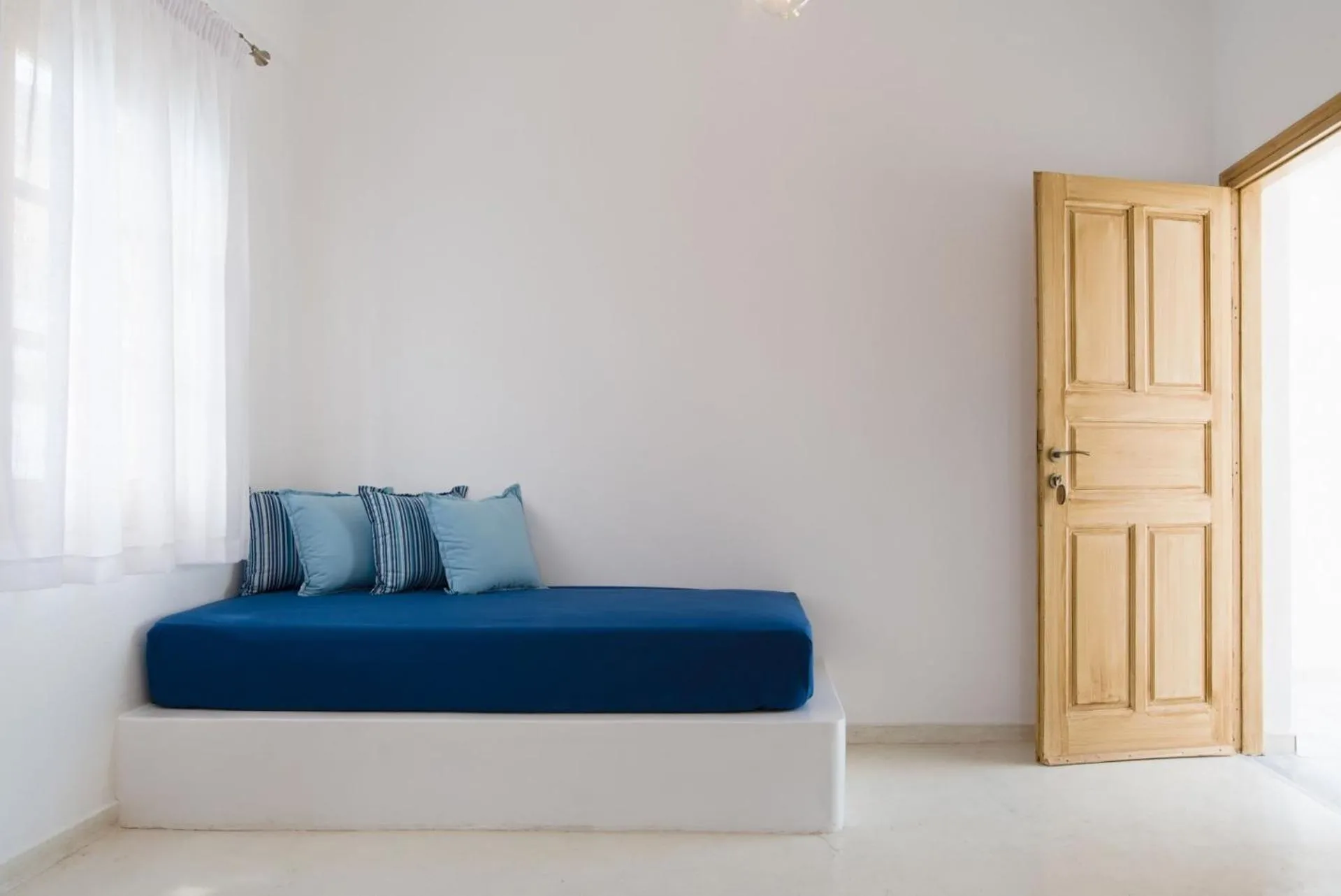 Seating area, Bed in Santorini Crystal Blue Boutique Hotel