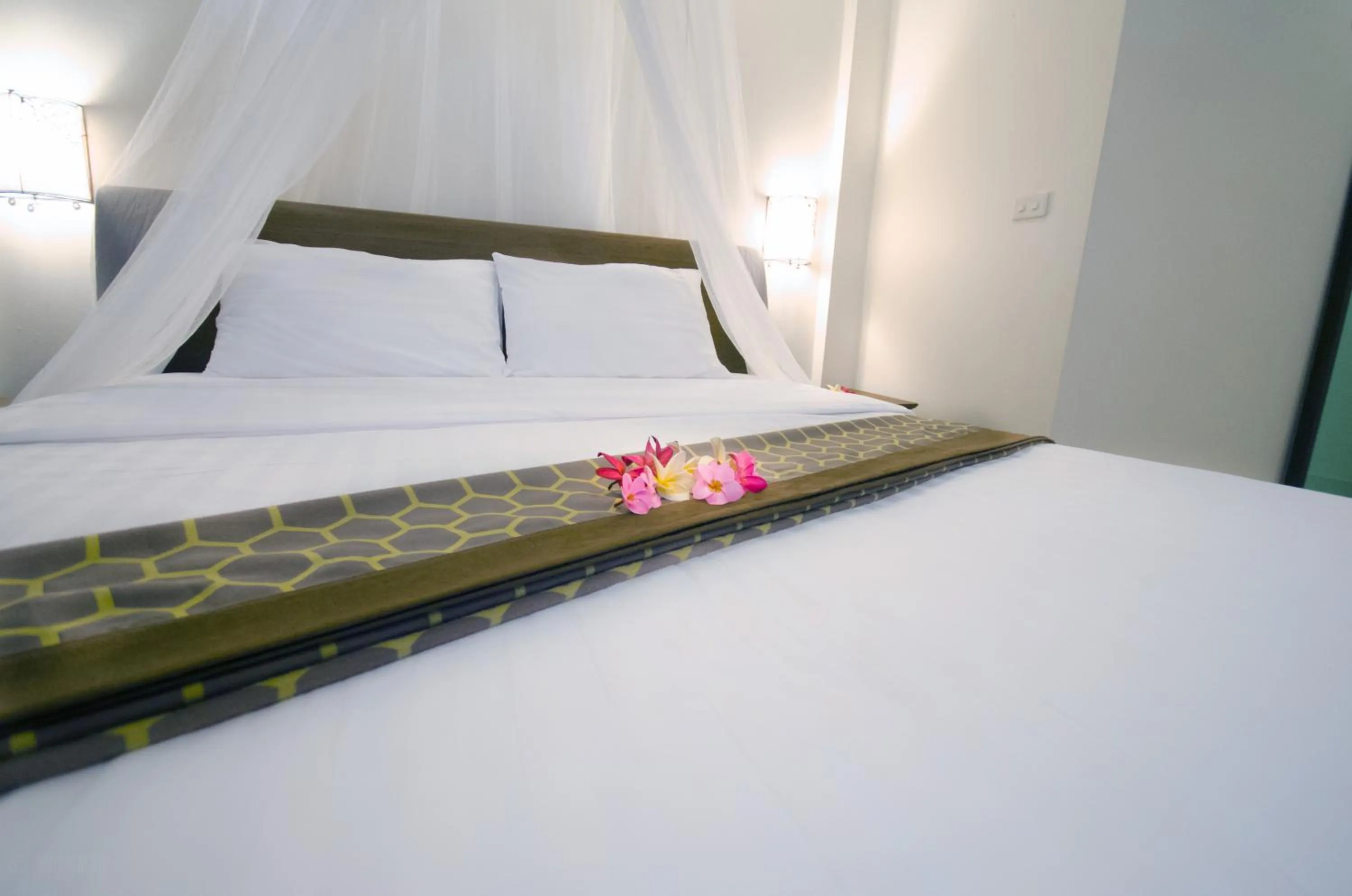 Bed in Namphung Phuket Boutique Resort