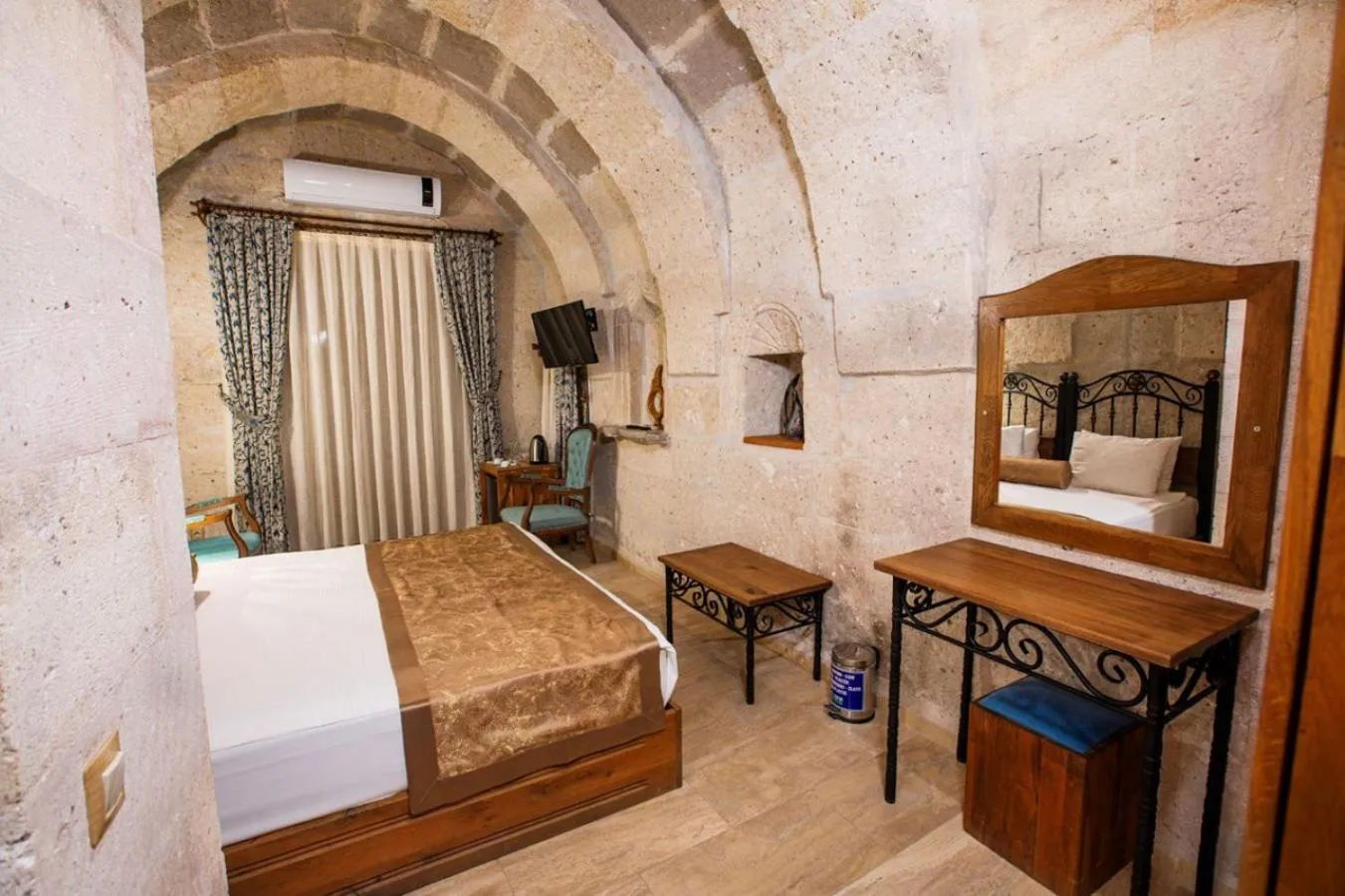 Bed in Caldera Cave Hotel